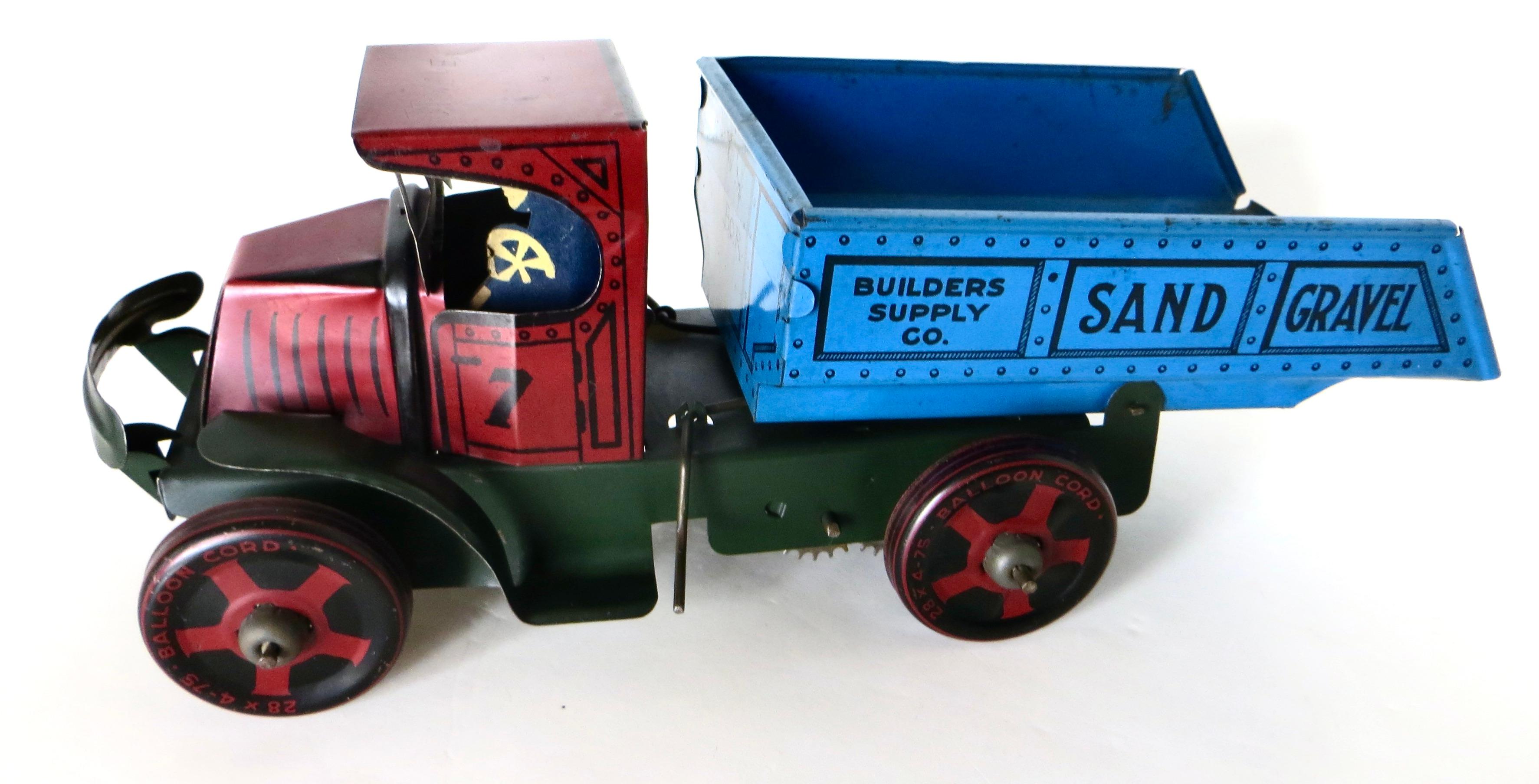 Offered is a hard to find Marx floor toy dump truck with dual action. NOT diecast------made of all tin.  Capability to raise and lower the bed is activated by rotating the attached axle and rotating it. The attached wind up key when wound with the