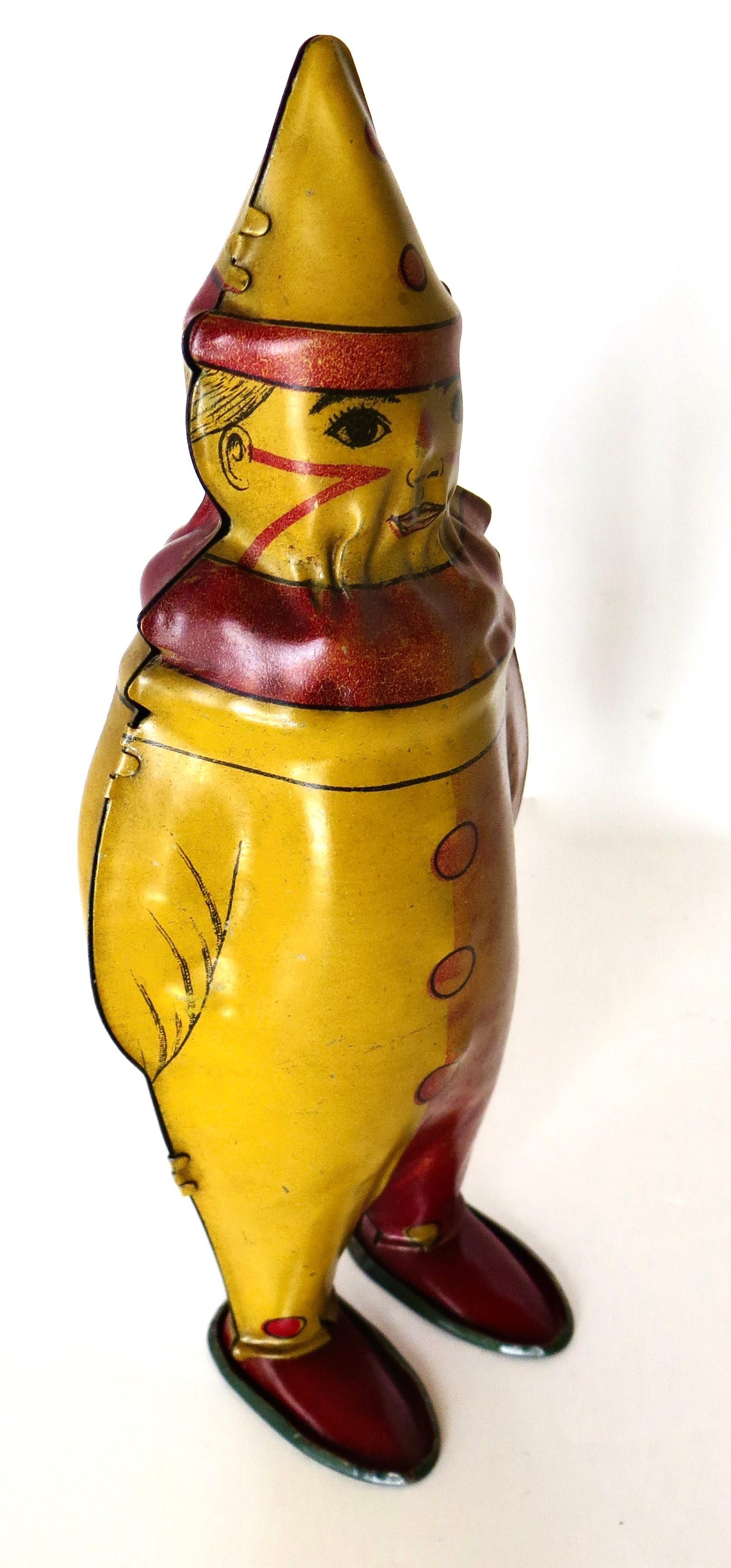 This is a hard to find pre war vintage, Made in America wind up tin toy by The Lindstrom Toy Company of Bridgeport, Connecticut, circa 1928-1932. The action is fabulous;  when wound up and released on a flat surface, it depicts 