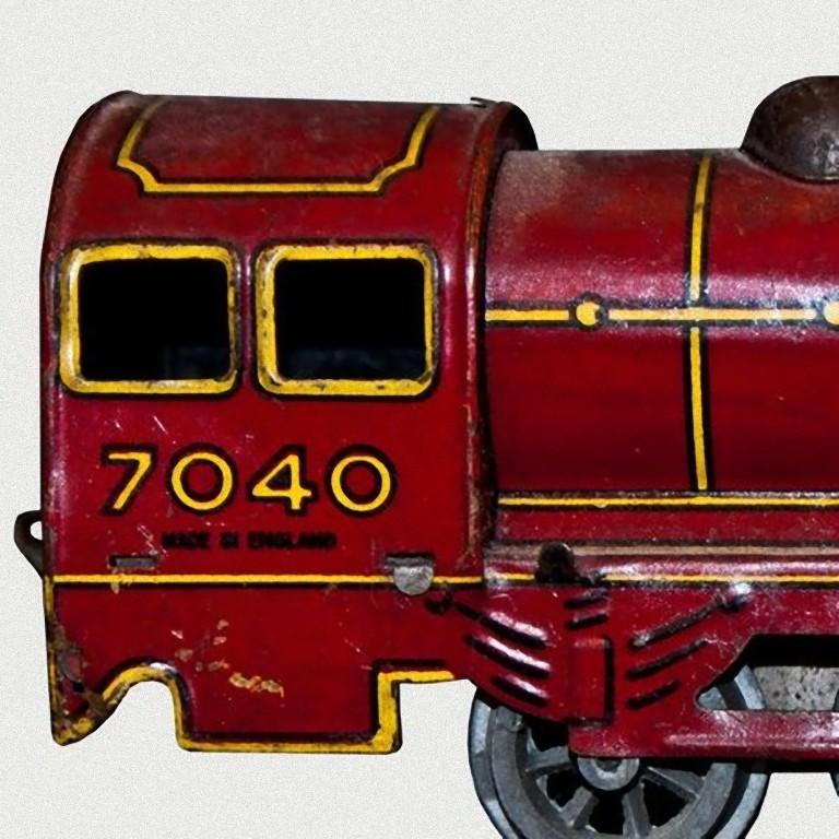 Diese Aufzieh-Lokomotive Wells-Brimtoy 7040 ist ein originales mechanisches Spielzeug.

Vintage Aufziehspielzeug, das eine Lokomotive darstellt.
Hergestellt aus lithographiertem Zinn von Wells-Brimtoy, Modell Nr. 7040.
Wahrscheinlich in den