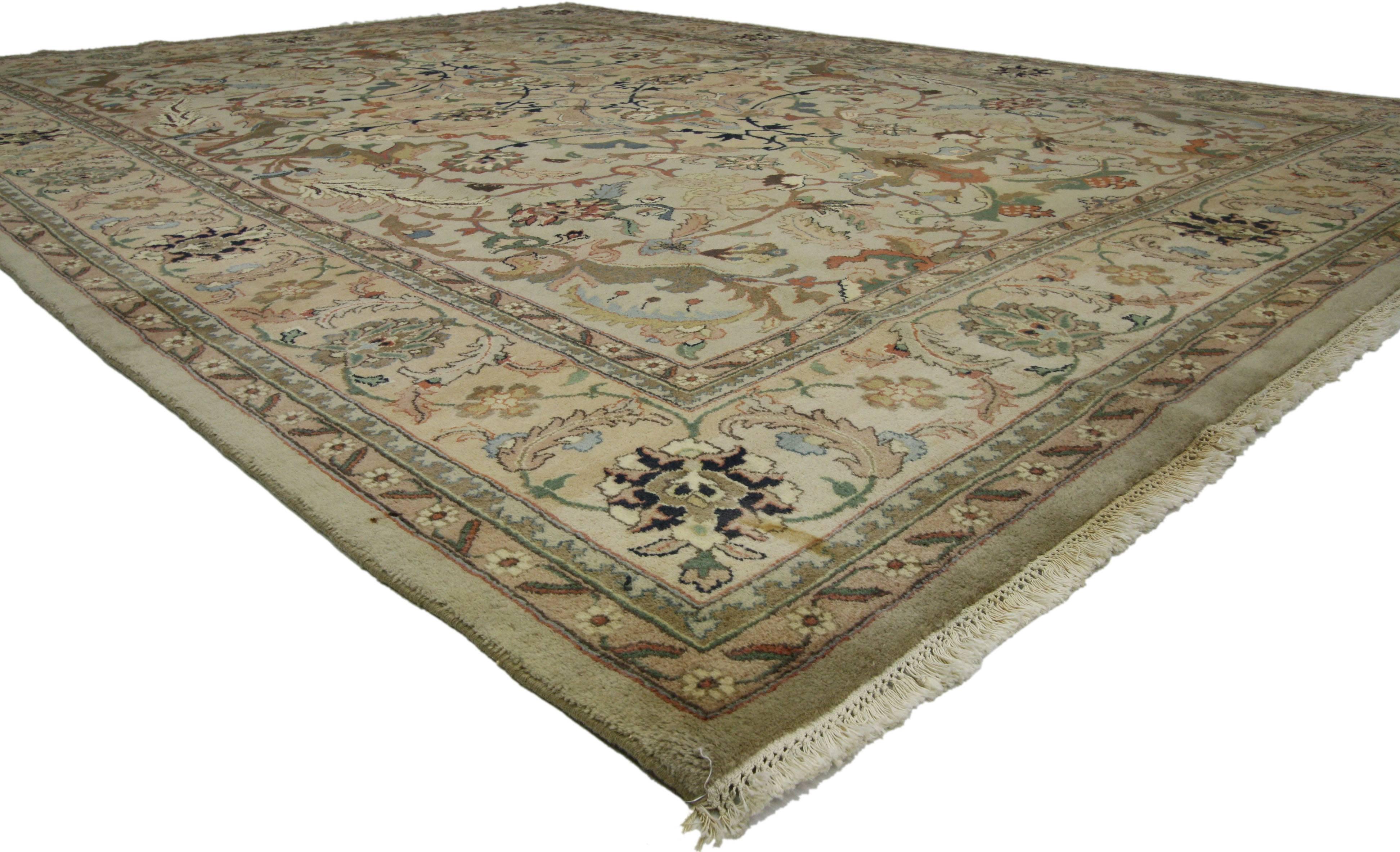 74867, a vintage traditional area rug with Persian Herati style. This hand-knotted wool vintage Persian style rug features a traditional Herati design. A scalloped medallion floats on a field of ecru covered in palmettes and boteh surrounded by a