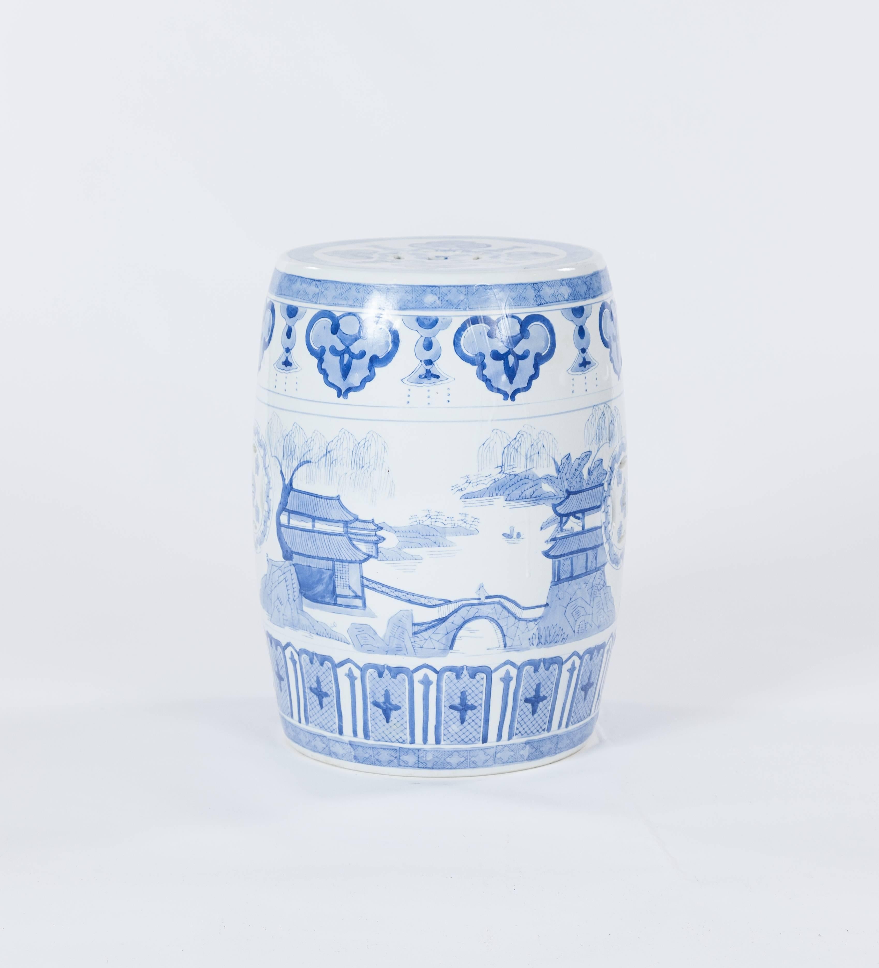 A vintage traditional Chinese blue and white porcelain garden stool dating to the late 20th century. The stool measures 12