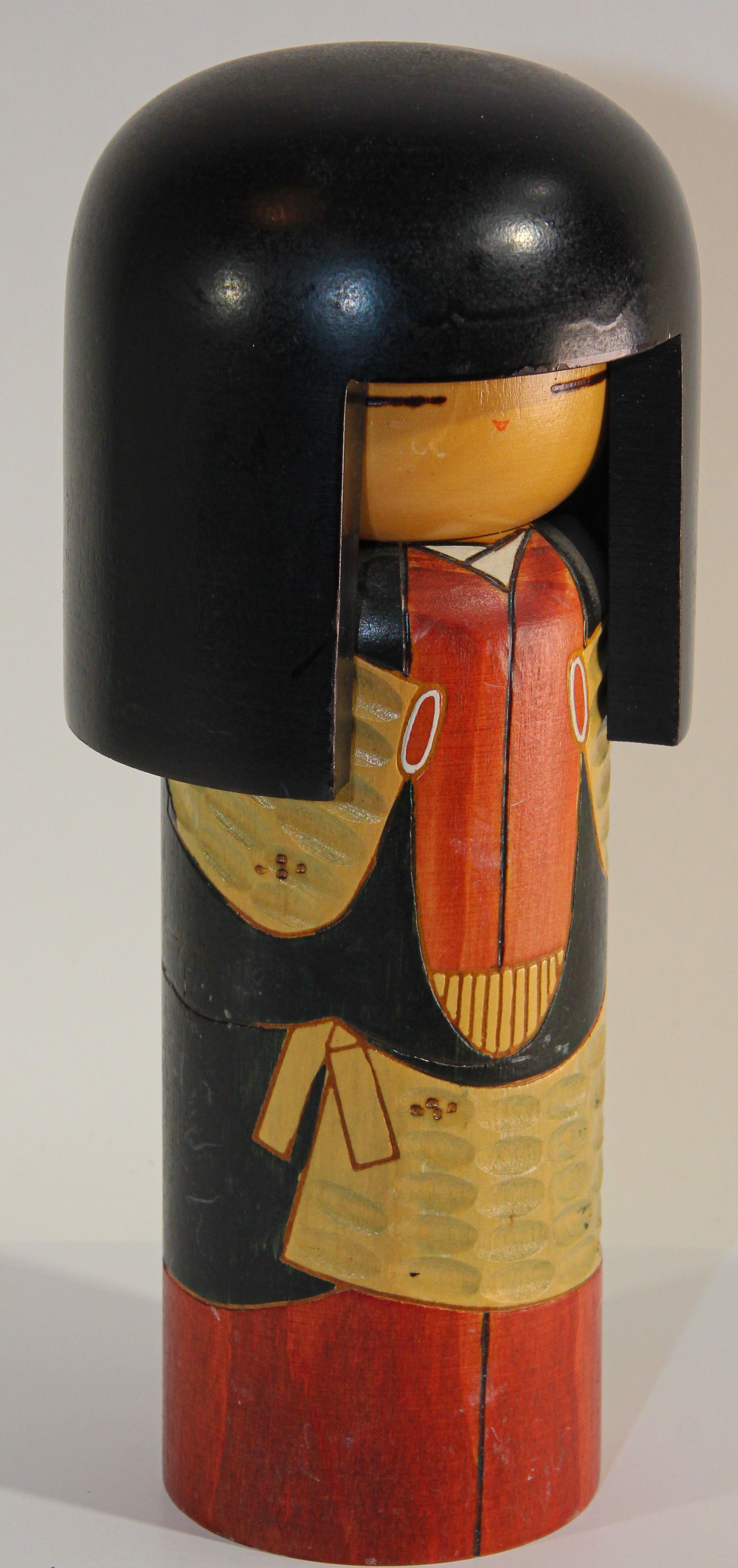 Kokeshi or Kokashi doll handmade by Japanese artisans from wood. 
The dolls have a simple trunk as a body and an enlarged head. 
One characteristic of Kokeshi dolls is their lack of arms and legs.
signed underneath as follow.
Kokashi Doll Kegon