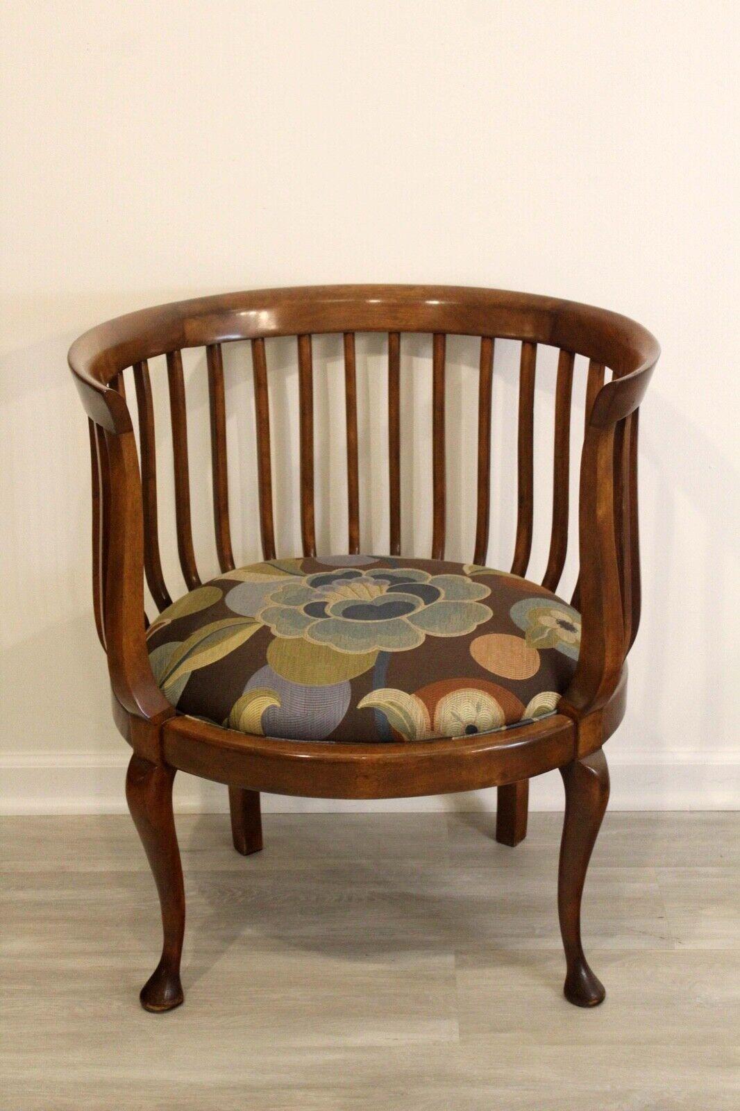 For your consideration is this cute and cozy Mission style tiger oak round back barrel chair.

Dimensions: 26.5w x 22d x 30.25h Arm Height: 30.25