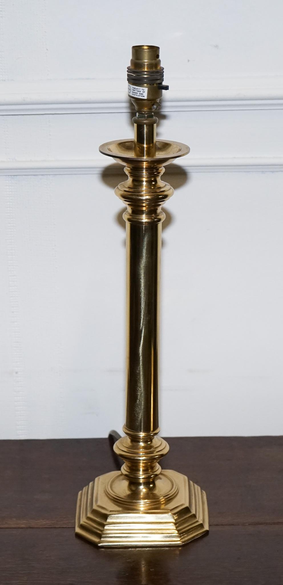 
Antiques of London



Add a touch of timeless elegance to your space with this vintage solid brass table lamp, featuring a fluted hexagonal base and a classic upright column. This piece blends beautifully into both traditional and transitional