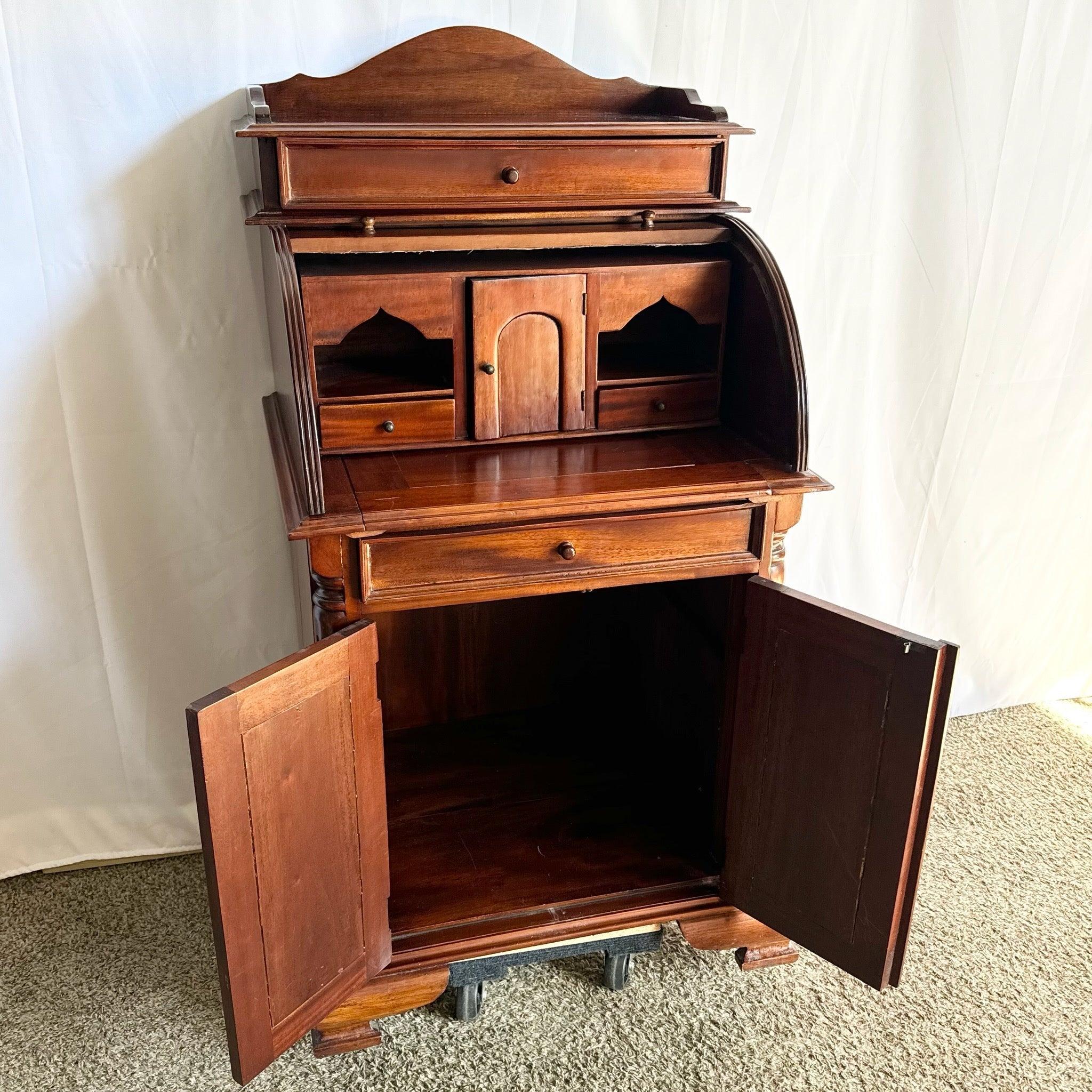 Vintage traditional roll-top secretary desk with tambour closure, spacious writing surface, and ample storage—ideal for home offices or studies.
 
 We sell items as acquired, without restoring or repairing. Vintage pieces may have age-related wear.