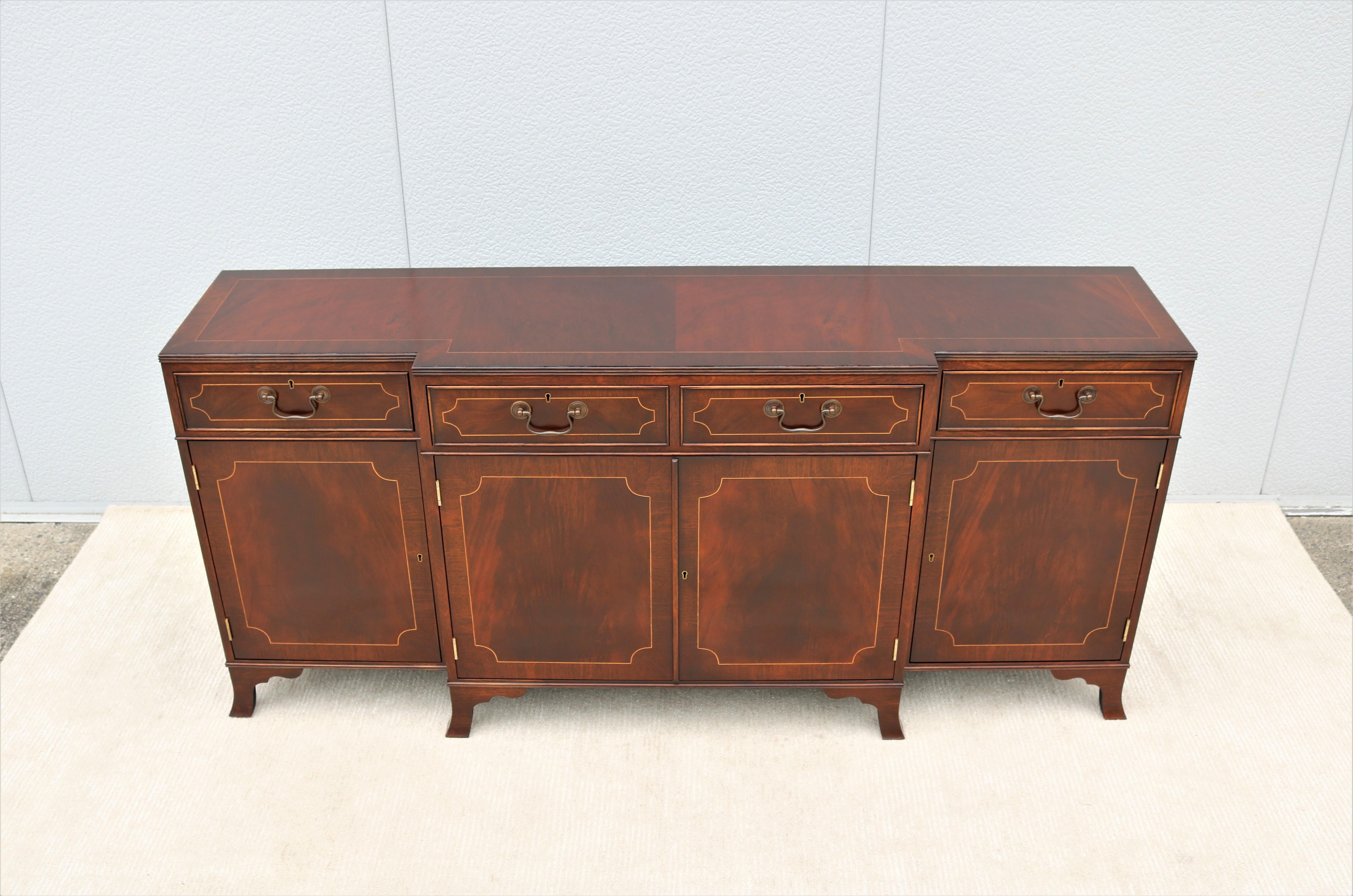 Fabulous vintage traditional English Sheraton style breakfronted mahogany cabinet.
A classic timeless and luxurious style inspired by the 18th and 19th century English design.
The construction of Trosby furniture is dedicated to hand-crafting with