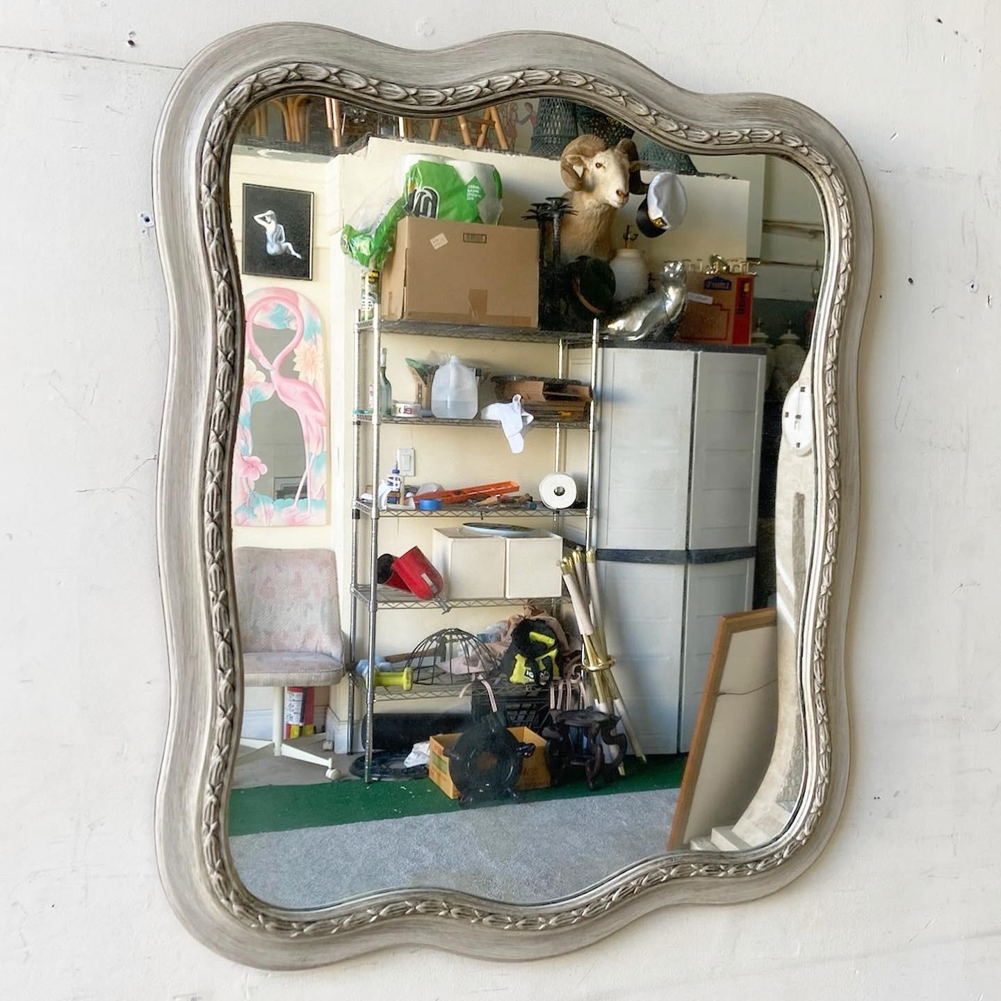 Exceptional and elegant vintage mirror. Acquired in a bedroom full of John Widdicomb furniture. Bears no signs and yields no maker’s marks.