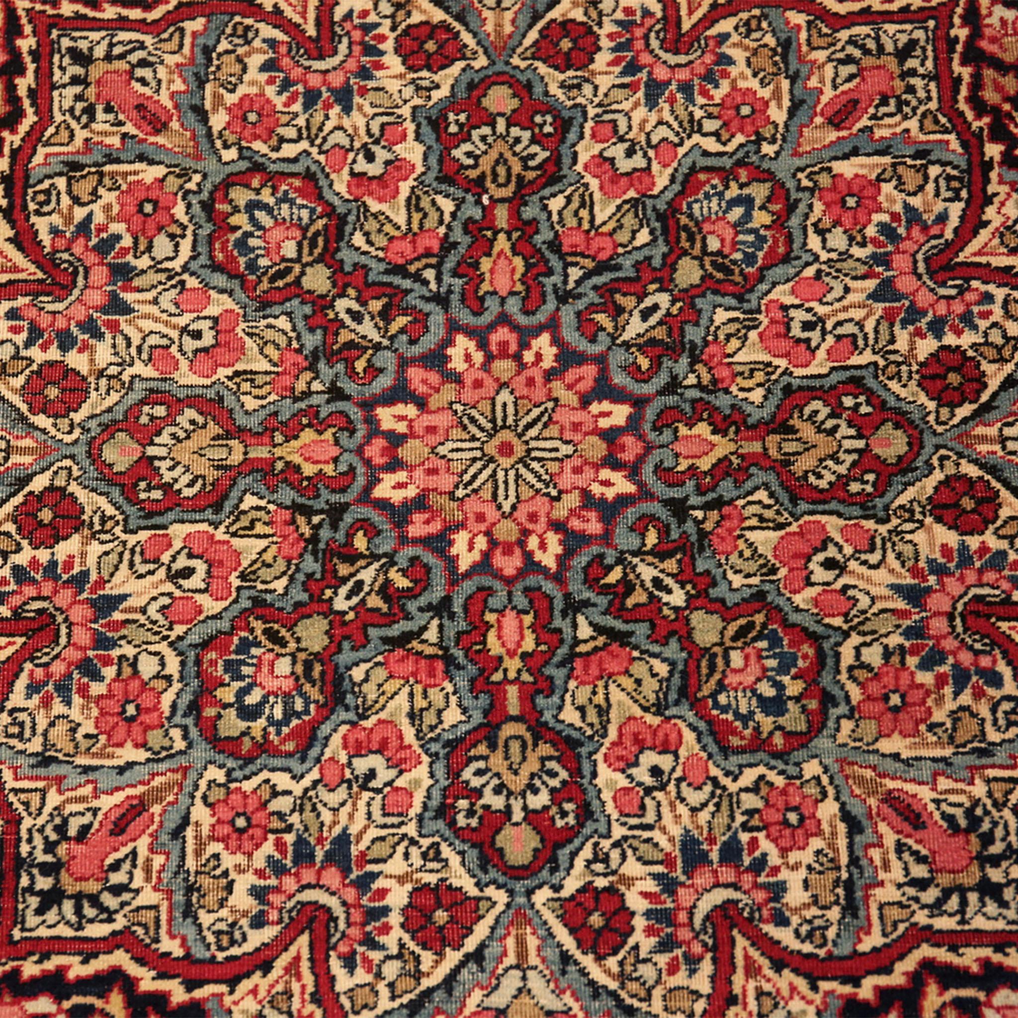 Originating from a city in south Iran, this traditional Persian Vintage Kerman Rug - 4'5