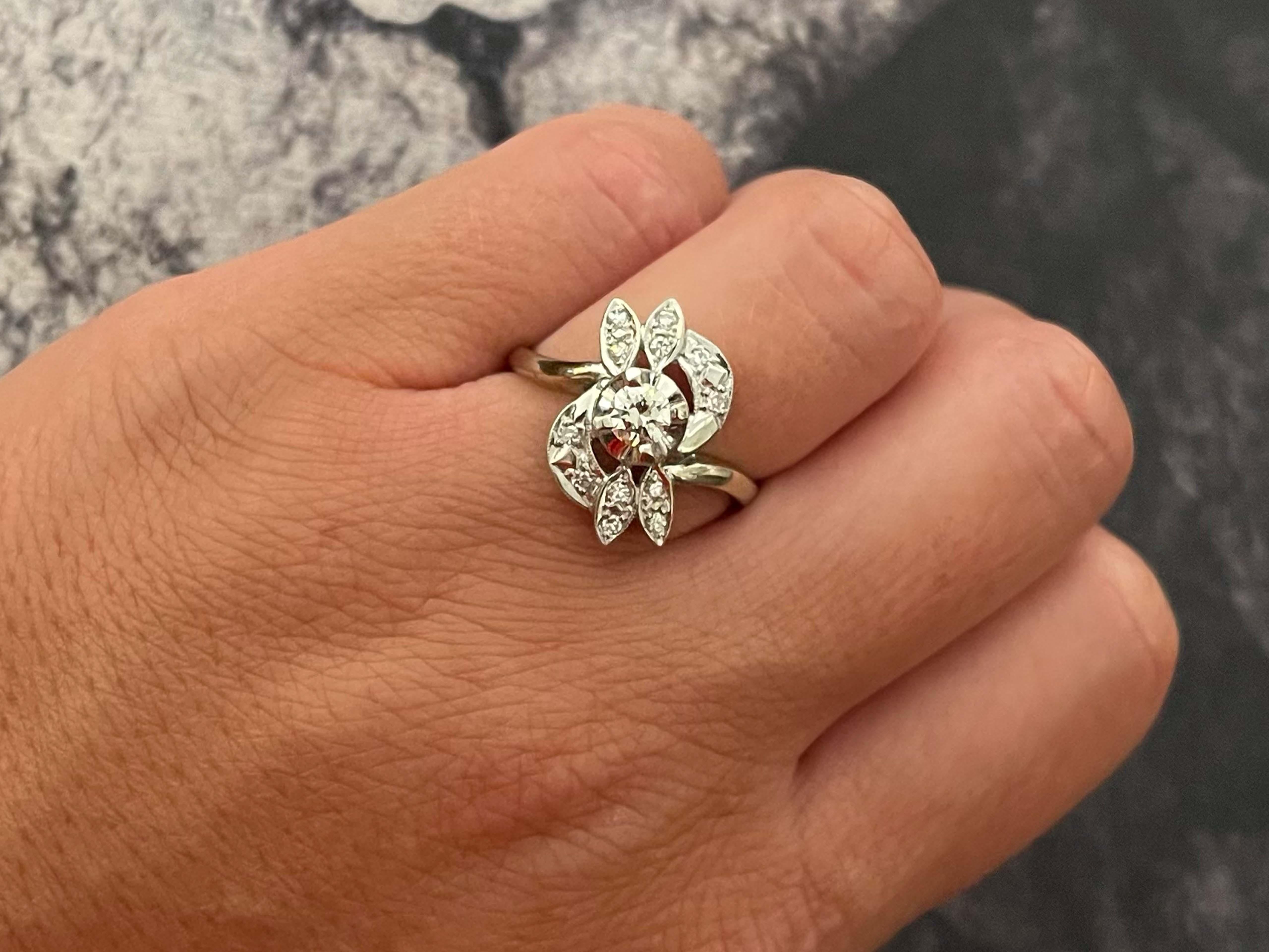 Item Specifications:

Metal: 14k White Gold

Style: Statement Ring

Ring Size: 9 (resizing available for a fee)

Total Weight: 4.4 Grams

Diamond Count: 1 transition cut and 12 single cut

Diamond Carat Weight: 0.30 + 0.06


Diamond Clarity:
