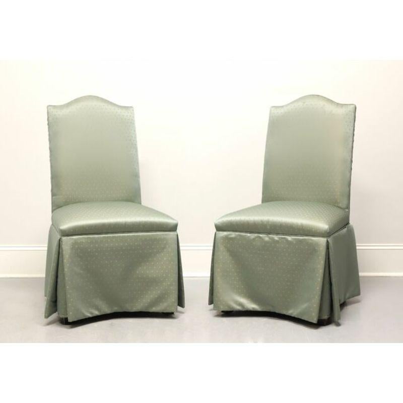 A pair of Transitional style Parsons chairs by Fairfield Chair Company. Solid wood frames covered with a gold dot on sage green shimmery fabric upholstery. Made in Lenoir, North Carolina, USA, in the late 20th Century. 

Style #: 6040-01

Measures: 