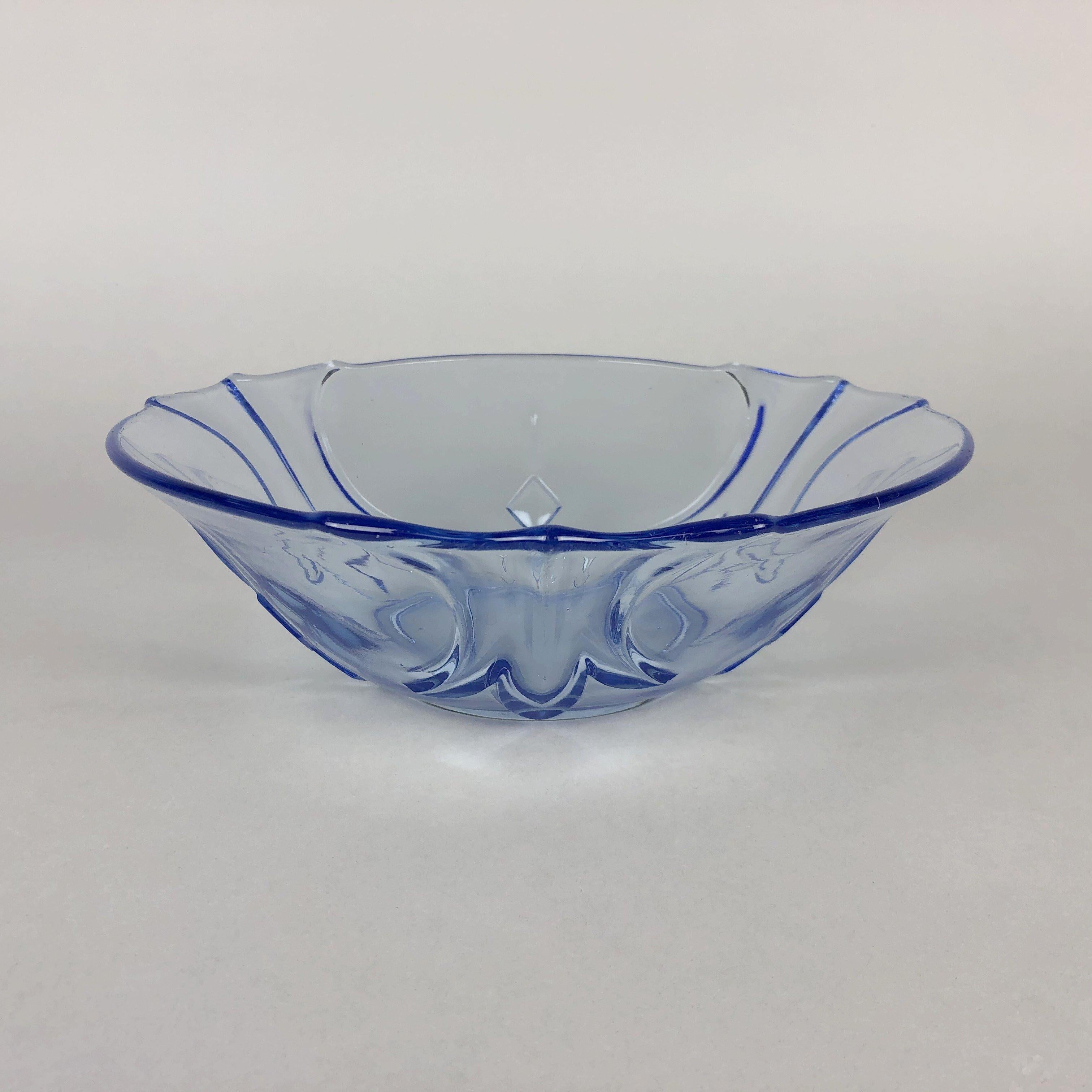 Lovely blue transparent vintage glass bowl. The bowl is approximately 8 cm (3.15 inch) and 24,5 cm (9.65 inch) wide.
