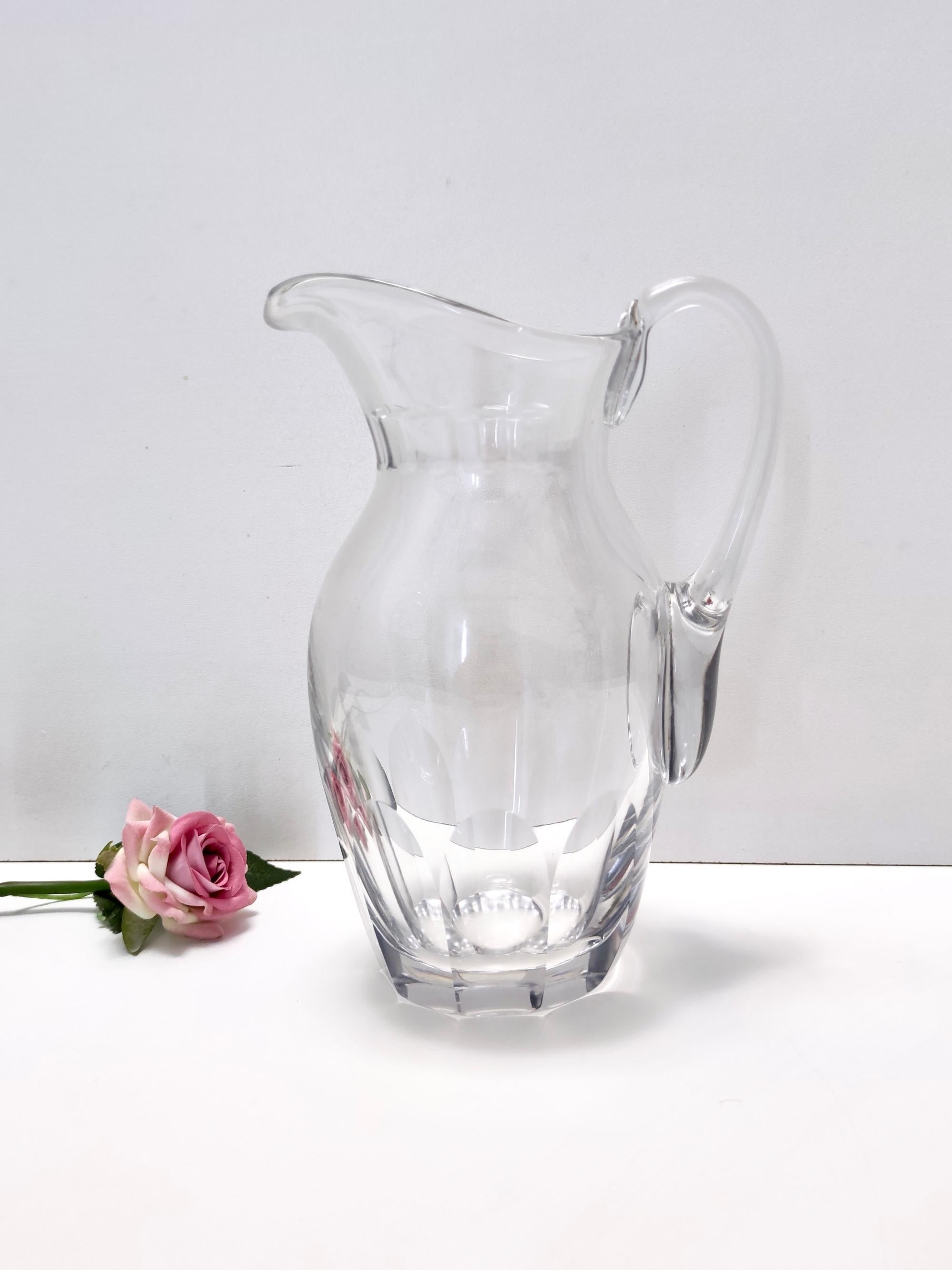 1960s.
This high-quality pitcher / vase is made in transparent crystal. 
It is a vintage piece, therefore it might show slight traces of use, but it can be considered as in perfect original condition and ready to become a piece in a home.