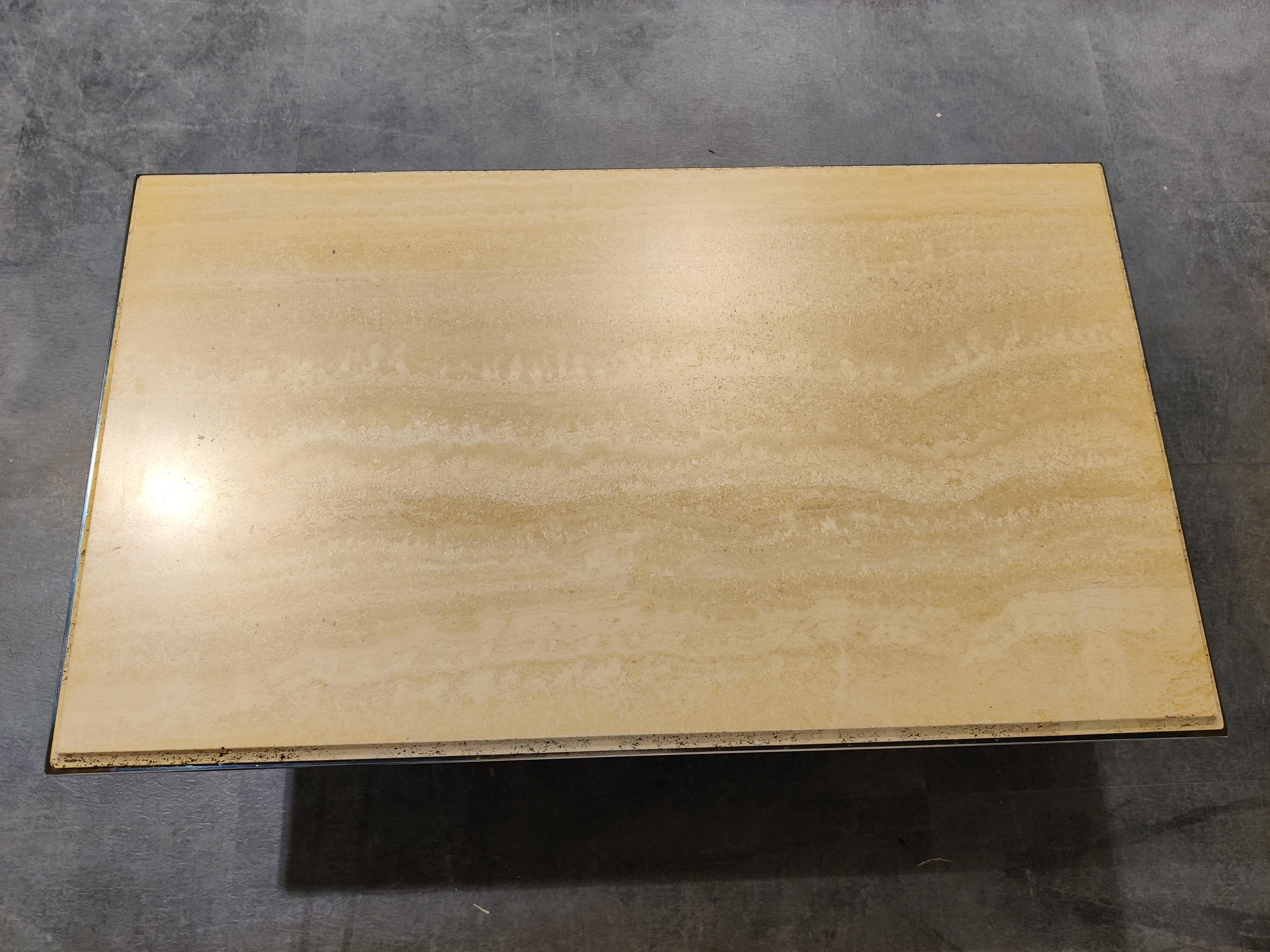 Rectangular travertine coffee table with a brass edge by Fedam

Natural travertine stone colour blends in perfectly with most interiors.

Good condition.

1970s - Belgium

Dimensions
Height: 38cm/14.96