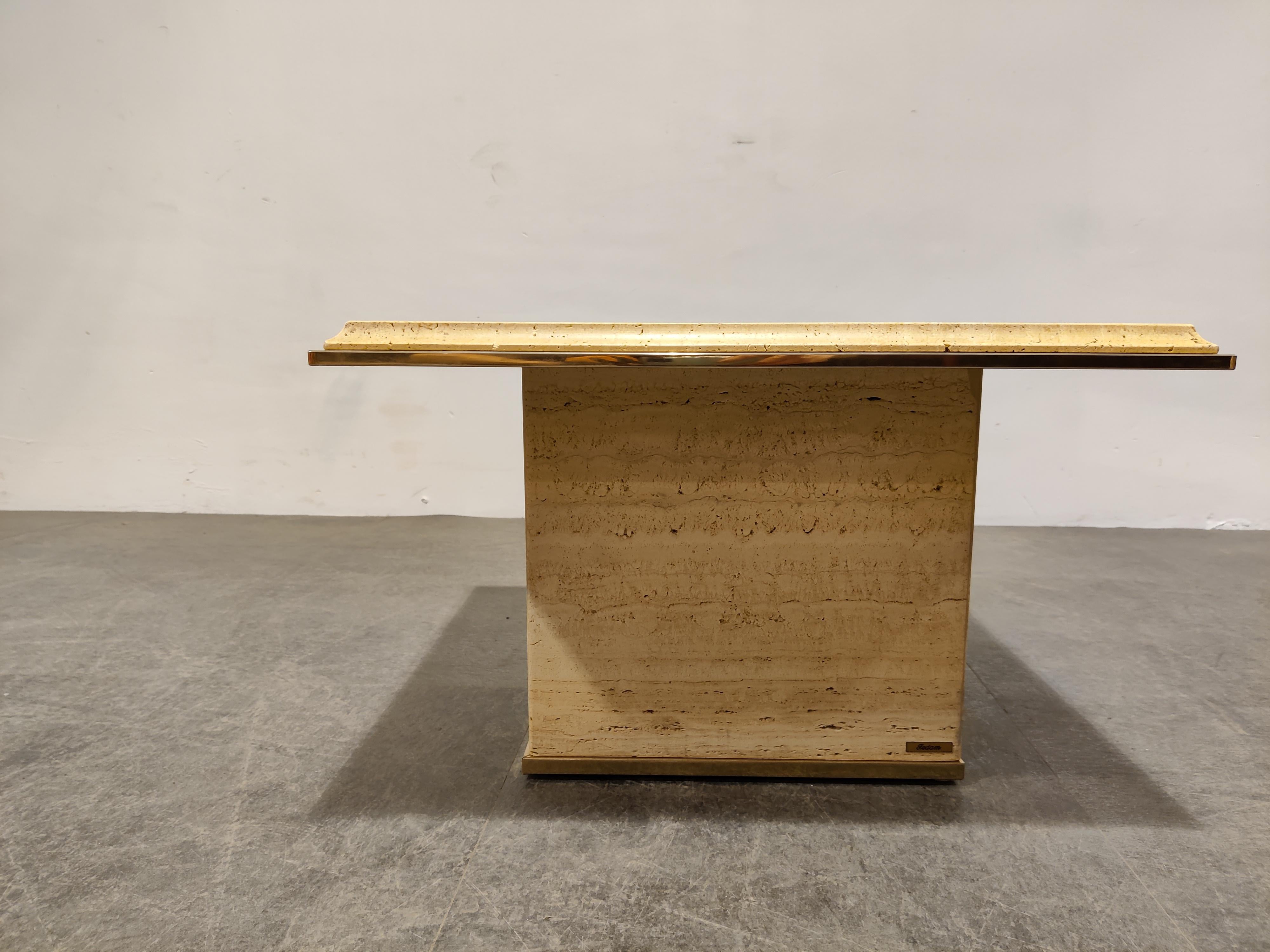 Square travertine coffee or side table with a brass edge by Fedam

Natural travertine stone colour blends in perfectly with most interiors.

Good condition.

1970s - Belgium

Dimensions
Height: 38cm/14.96