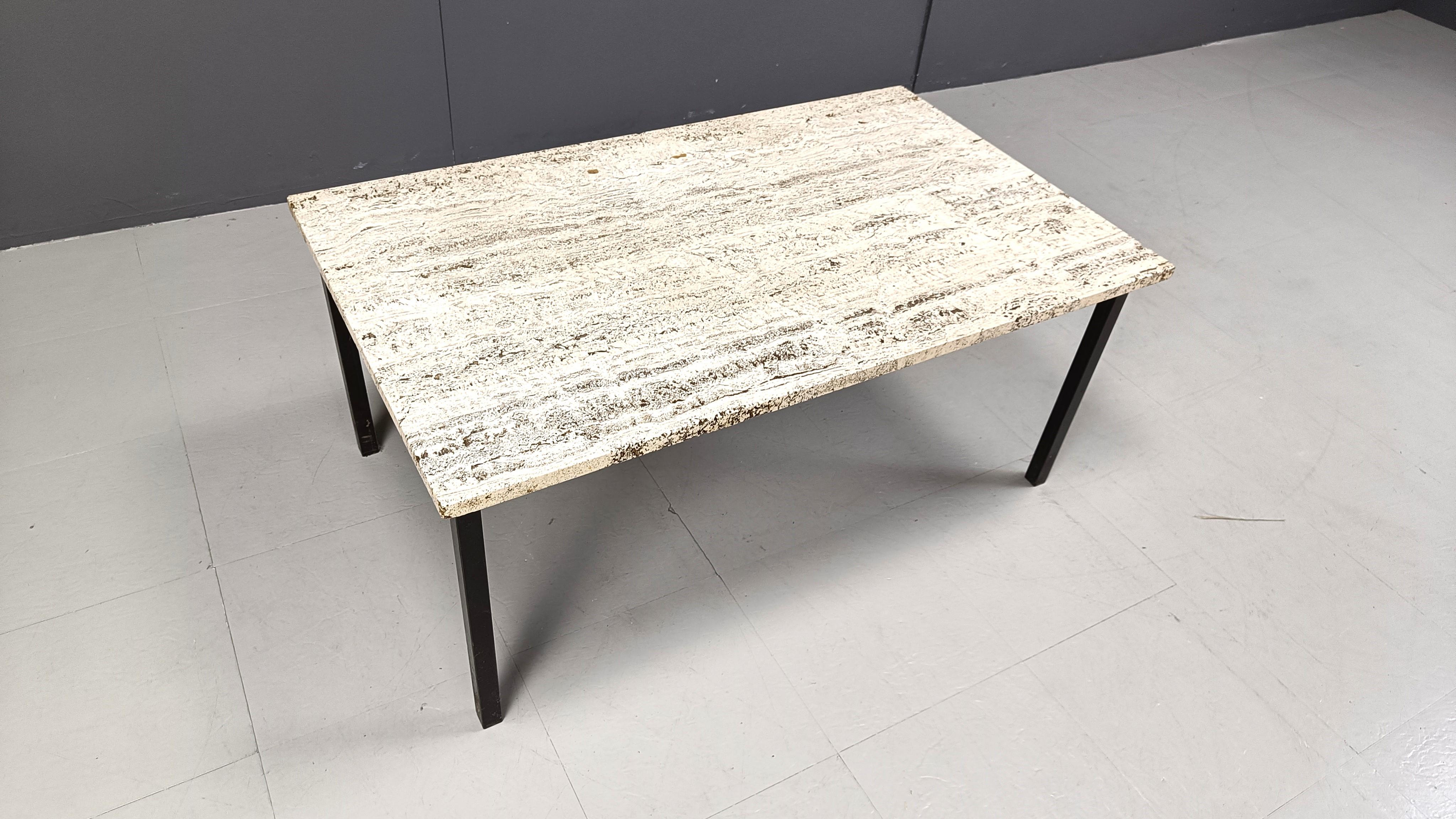 Rectangular travertine coffee table on a black metal 4 legged base.

Beautiful porous travertine stone.

1970s - italy

Height: 44cm
width: 100cm
Depth: 60cm

Ref.: 36126
