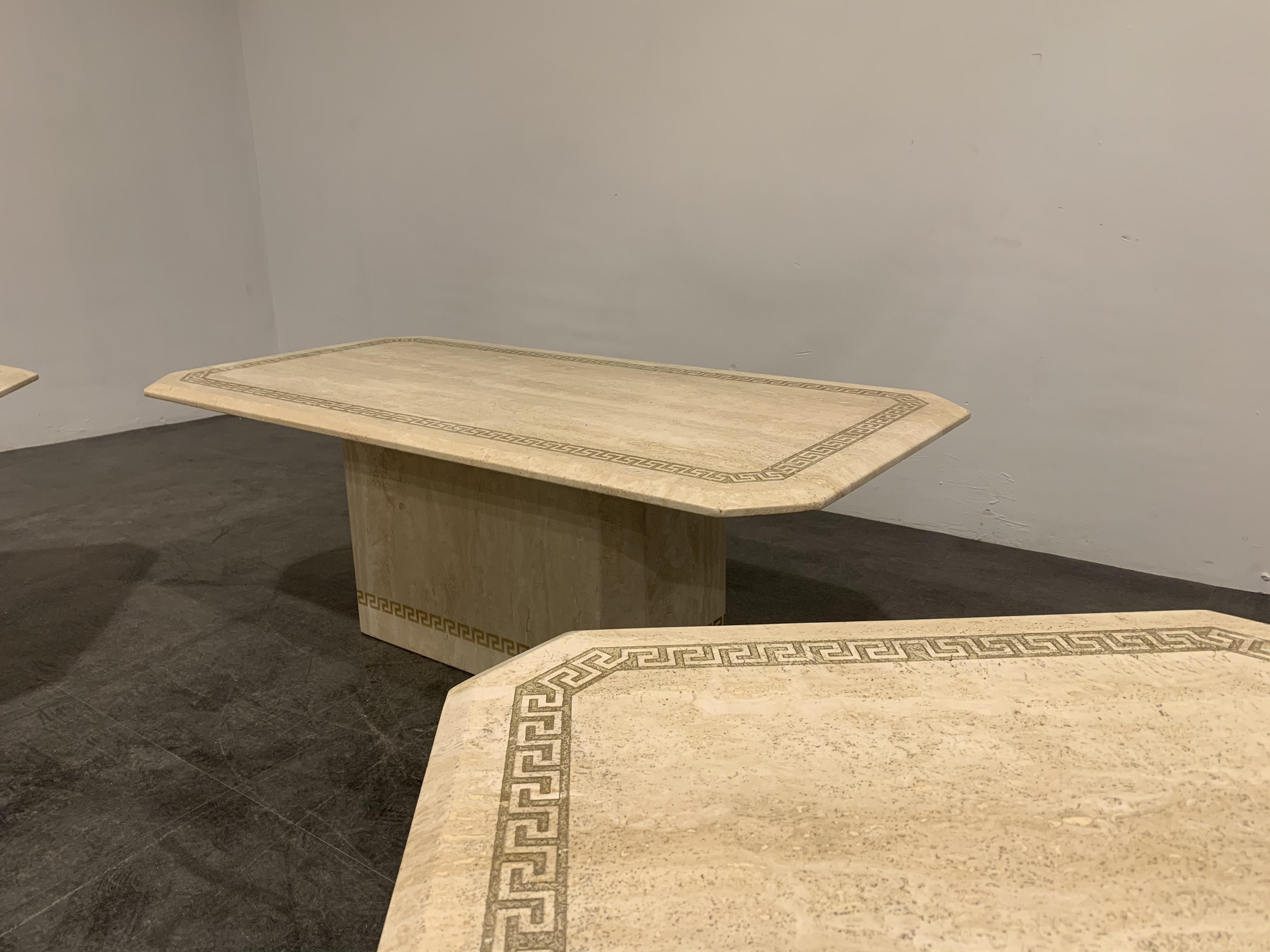 Set of exquisite travertine coffee table and side tables.

Finely finished table tops with inlaid stone Greek key decorations. The bases have these same decorations in gold paint.

Beautiful color.

Very good condition

1980s -