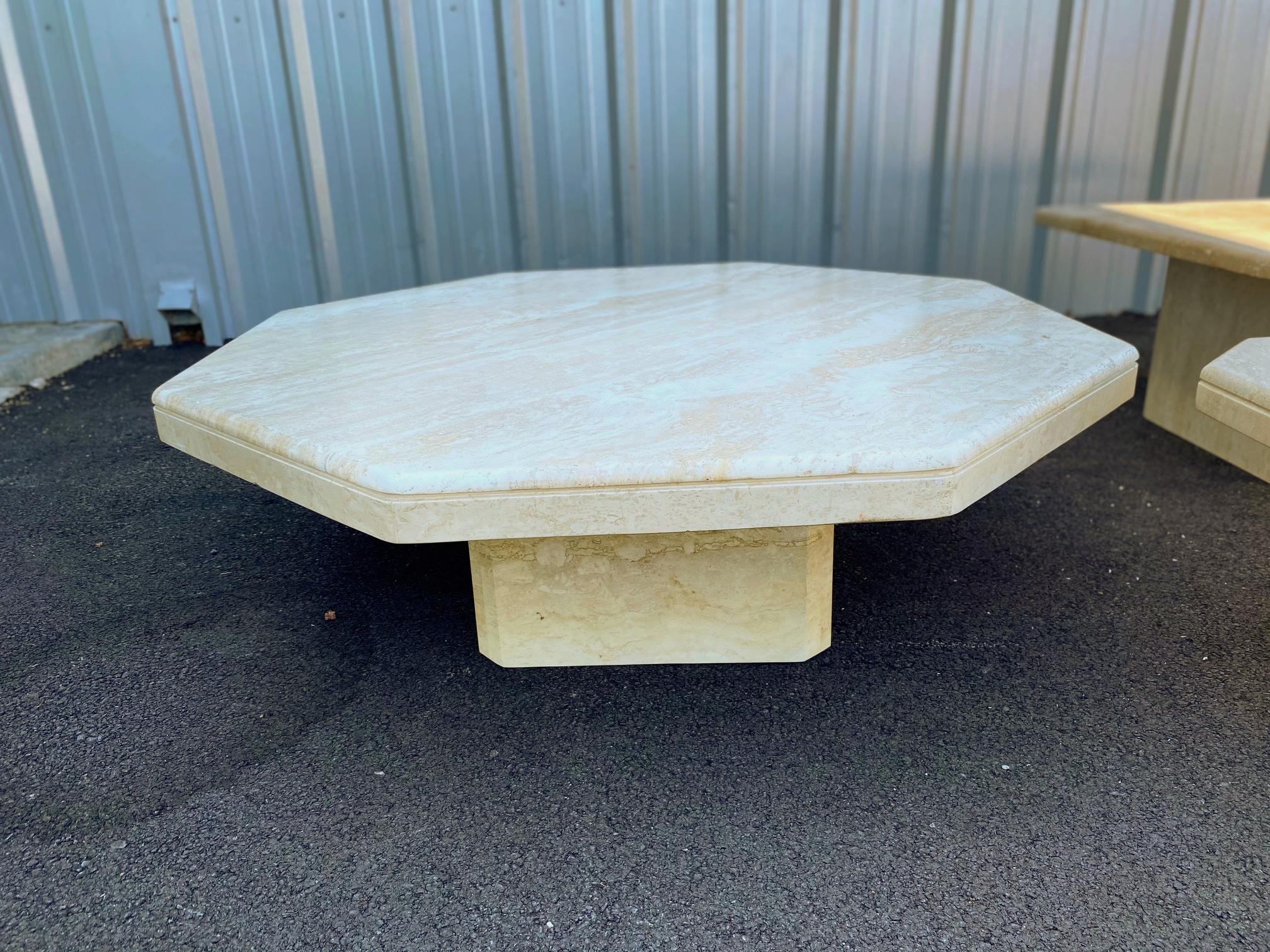 Beautiful Italian travertine octagonal coffee table, circa early 1980s comes in two pieces, pedestal and table top. There are no cracks and coffee table is in good vintage condition. Coloring of the table is shown in natural outdoor light and inside