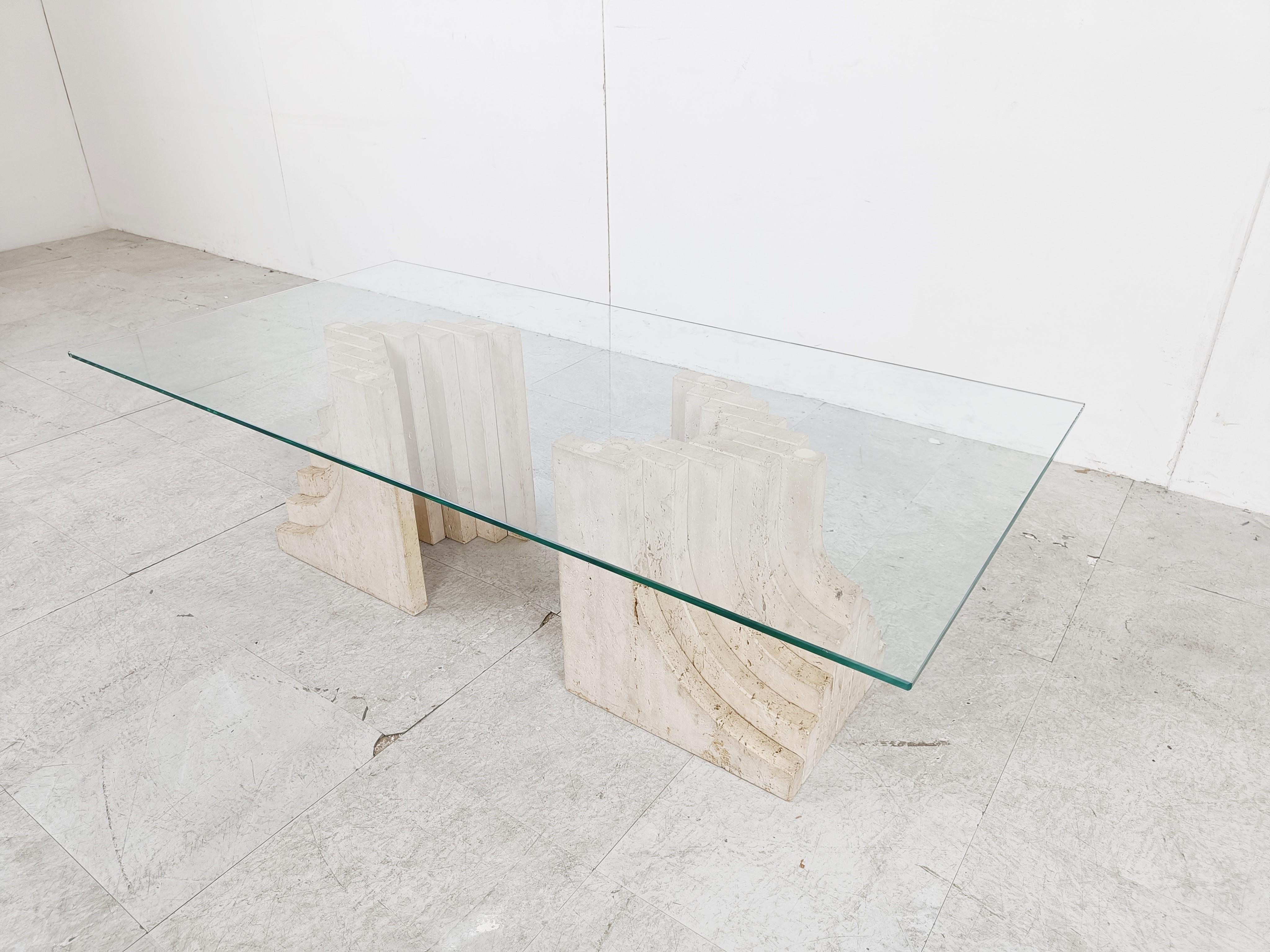 Vintage travertine coffee table with a clear glass top and stepped travertine bases in the style of Carlo Scarpa.

Great look, timeless design.

1970s - Italy

Good condition

Height: 36cm/14.17