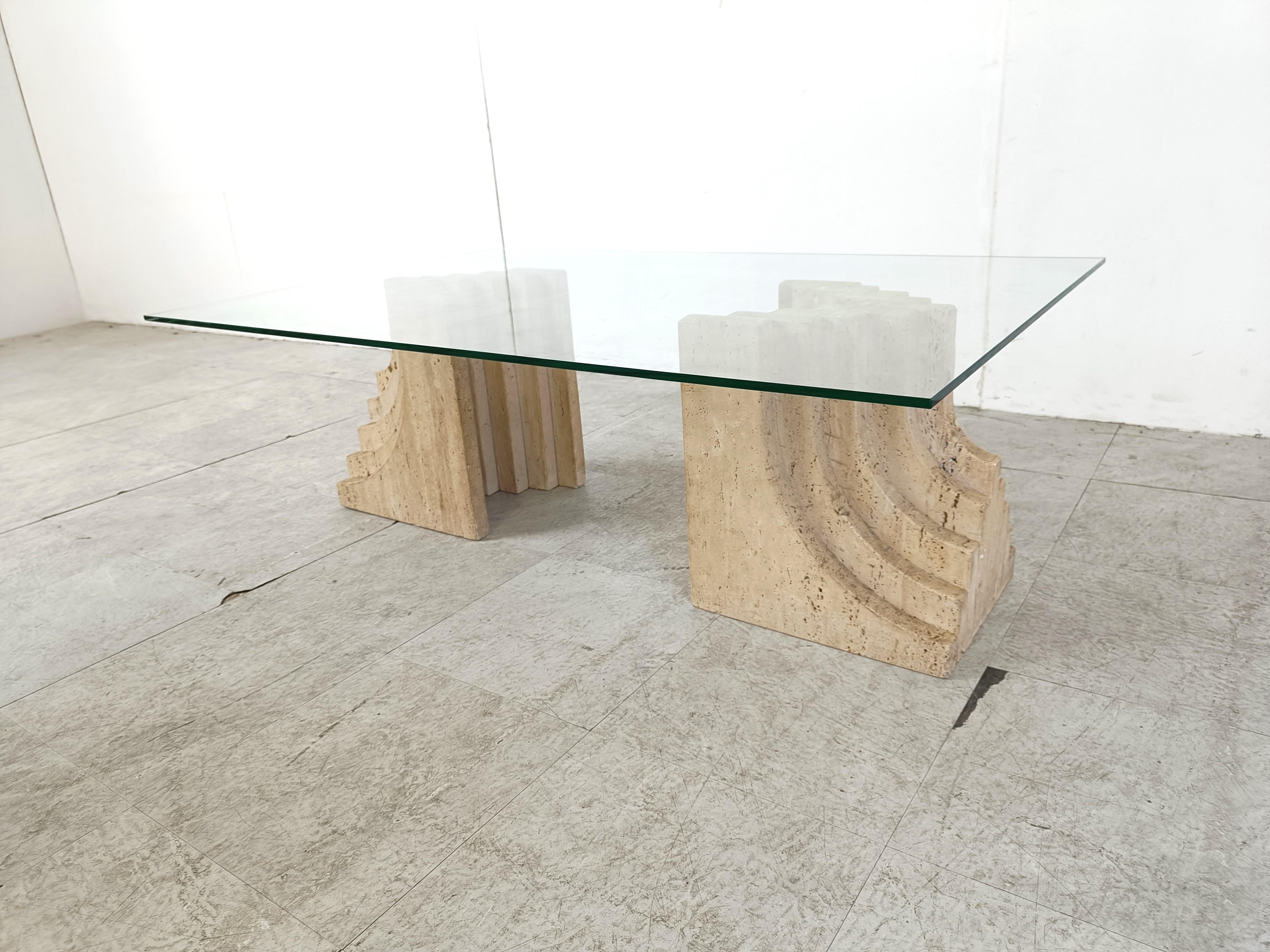 Vintage travertine coffee table with a clear glass top and stepped travertine bases in the style of Carlo Scarpa.

Great look, timeless design.

1970s - Italy

Good condition

Height: 37cm/14.56