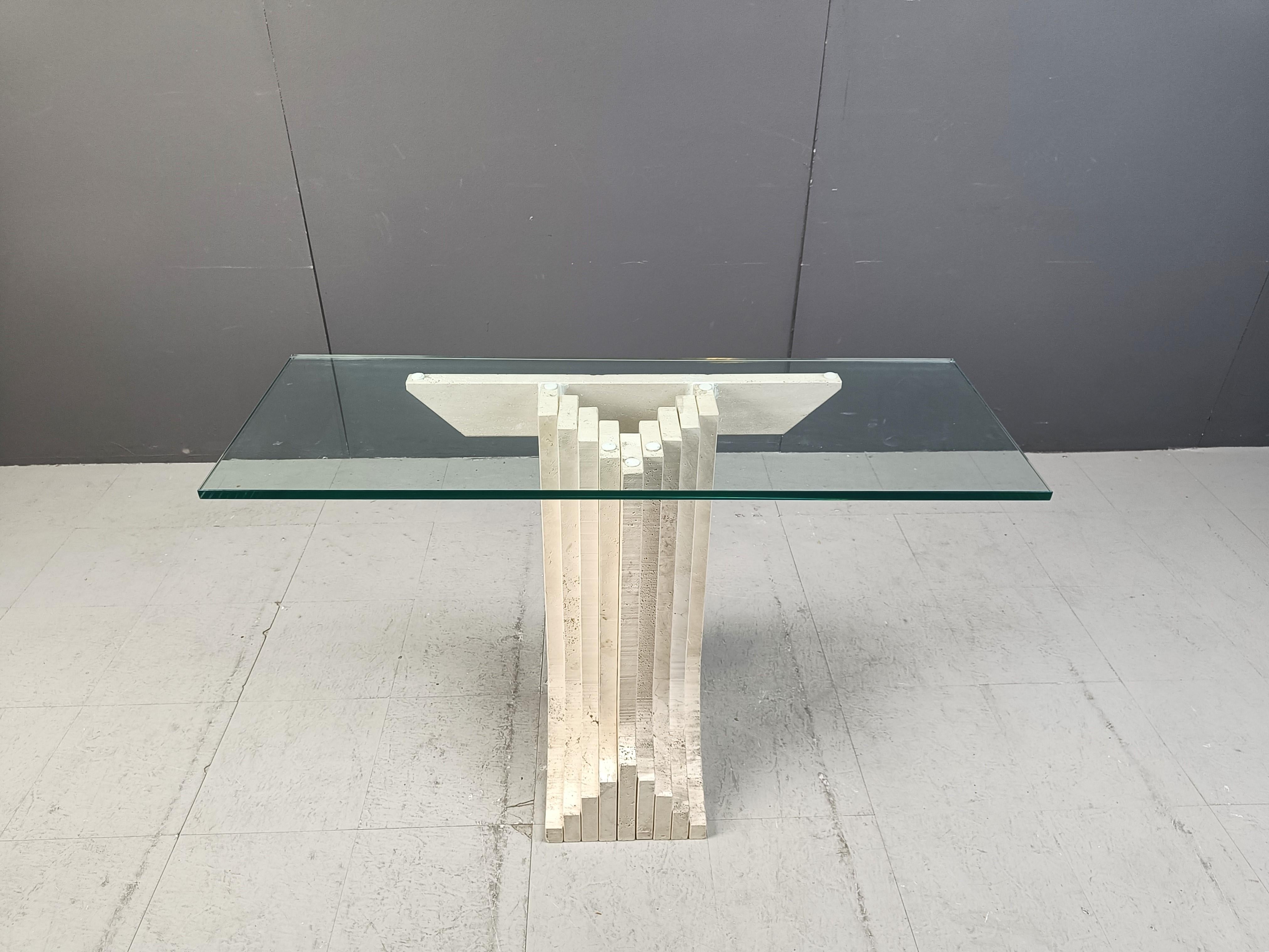 Wonderful architectural travertine console table in the manner of Carlo Scarpa.

Beautiful timeless look.

Good condition.

Dimensions:
Height: 74cm
Width: 110cm
Depth: 40cm

Ref.: 24120906

A custom glass size can be provided by us, contact us for