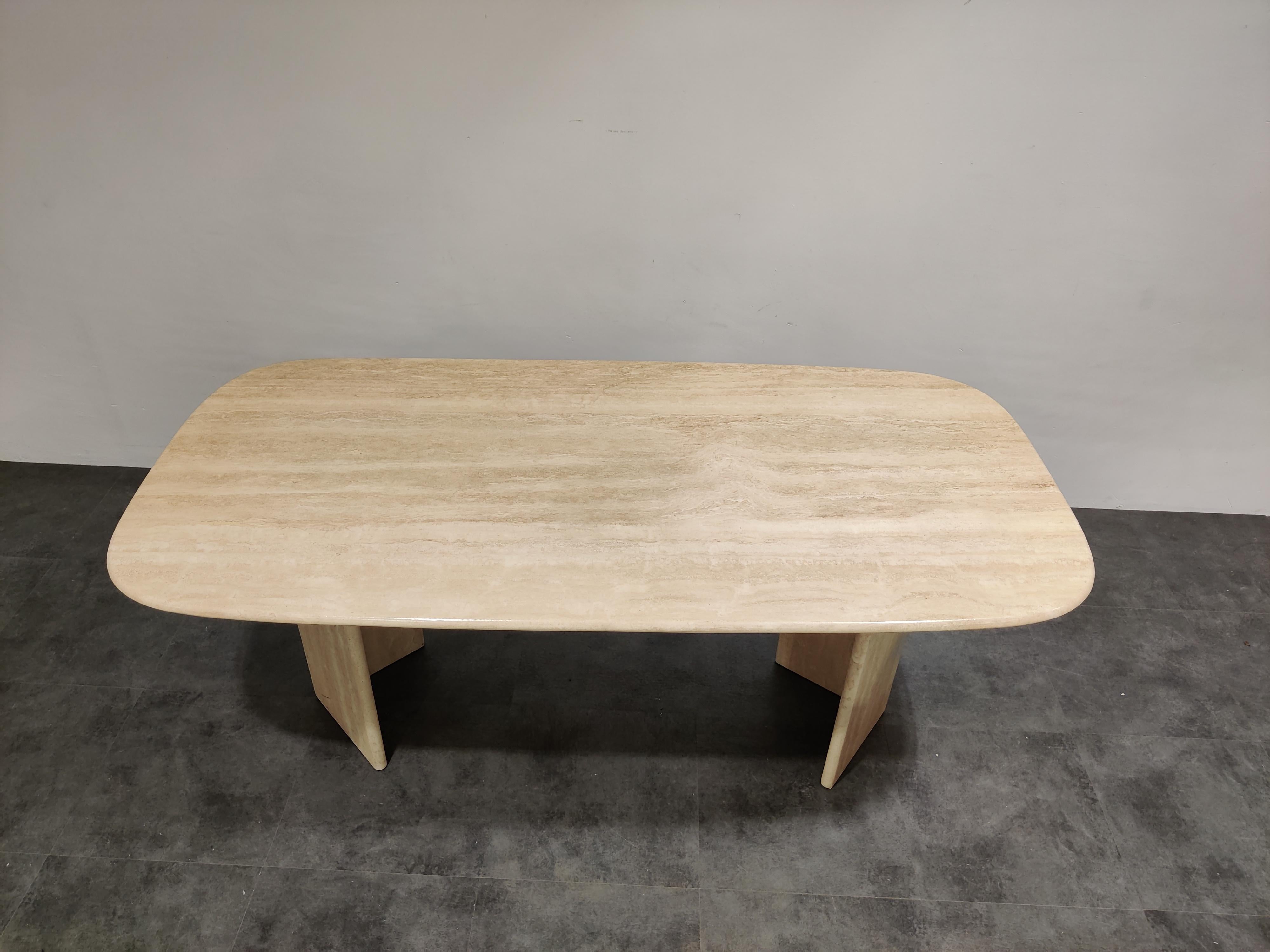 Elegant travertine dining table with two bases. 

Beautiful coloured travertine with lovely pattern.

Timeless and very beautiful table which fits most interiors.

Good condition. 

1970s - Italy

Dimensions:
Height: 75cm/29.52