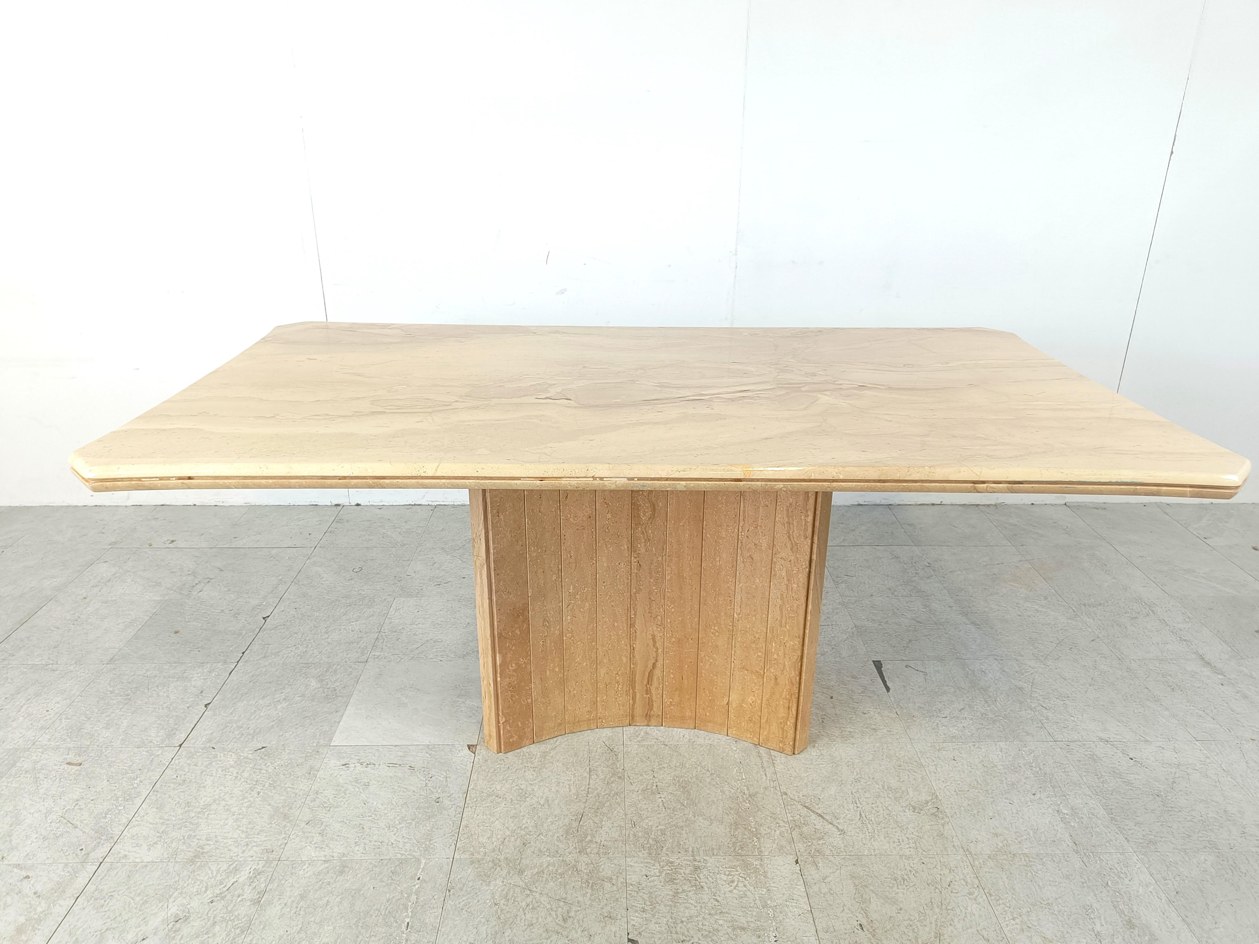 Elegant travertine dining table. 

Beautiful coloured travertine with a nice pattern.

Timeless and very beautiful table wich fits most interiors.

The table top has some unusual corners and an elegant base.

Good condition. 

1970s -