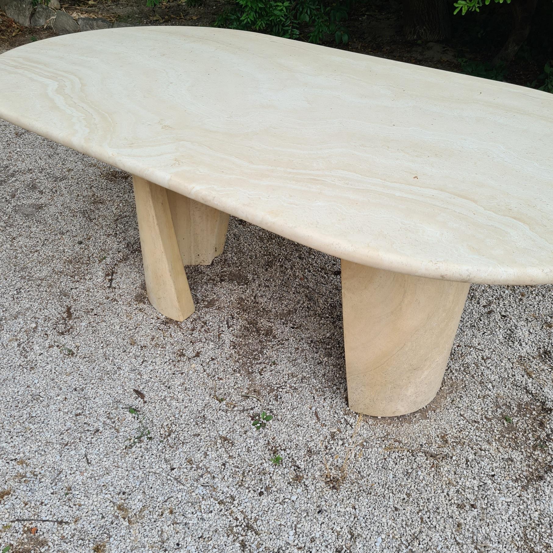 Vintage travertine dining table with2 beautiful legs in very good condition.