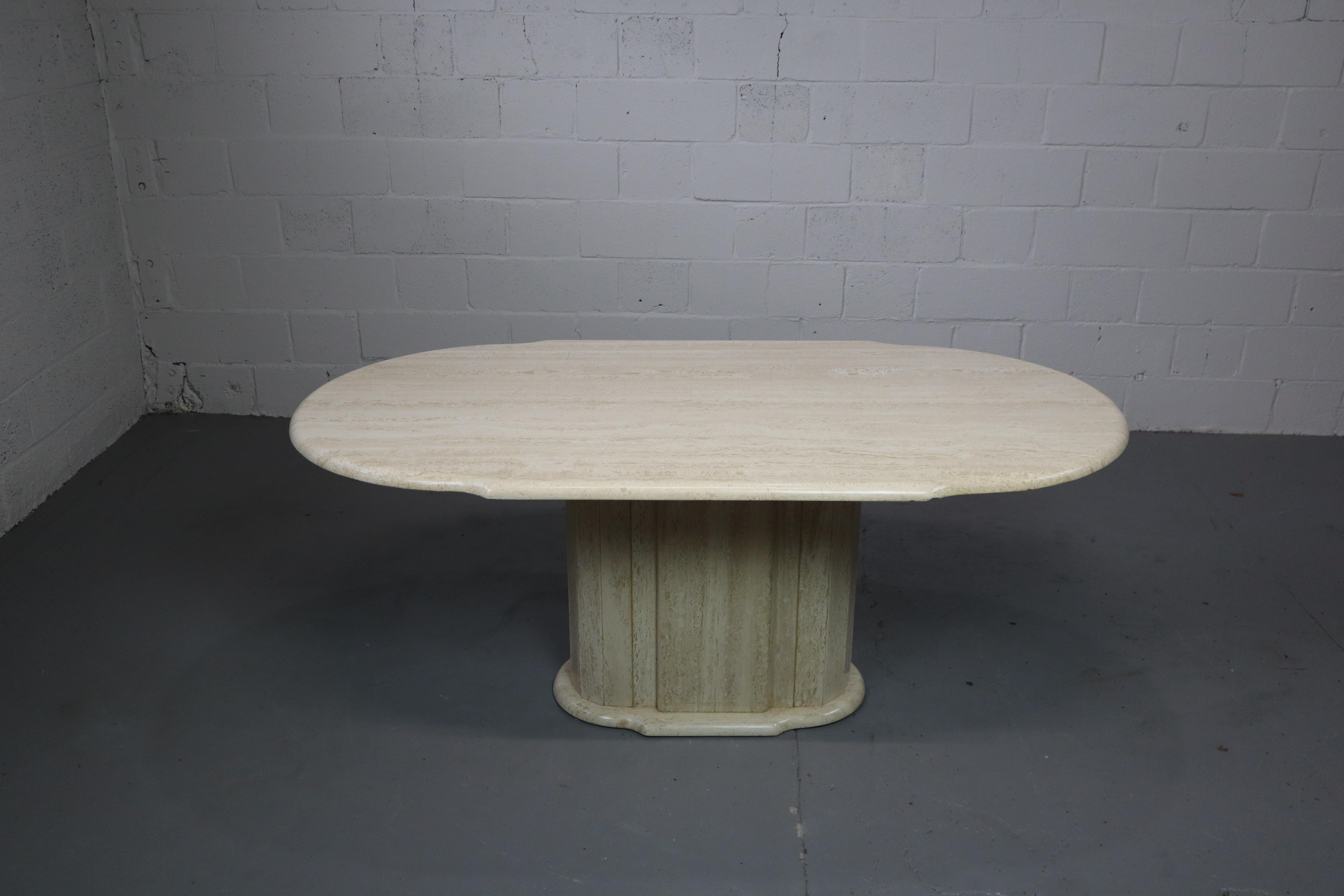 Travertine dining table with nice colour and pattern.

Fits in both a contemporary and a vintage interior

The table top is supported by a central column and steel cross. 
