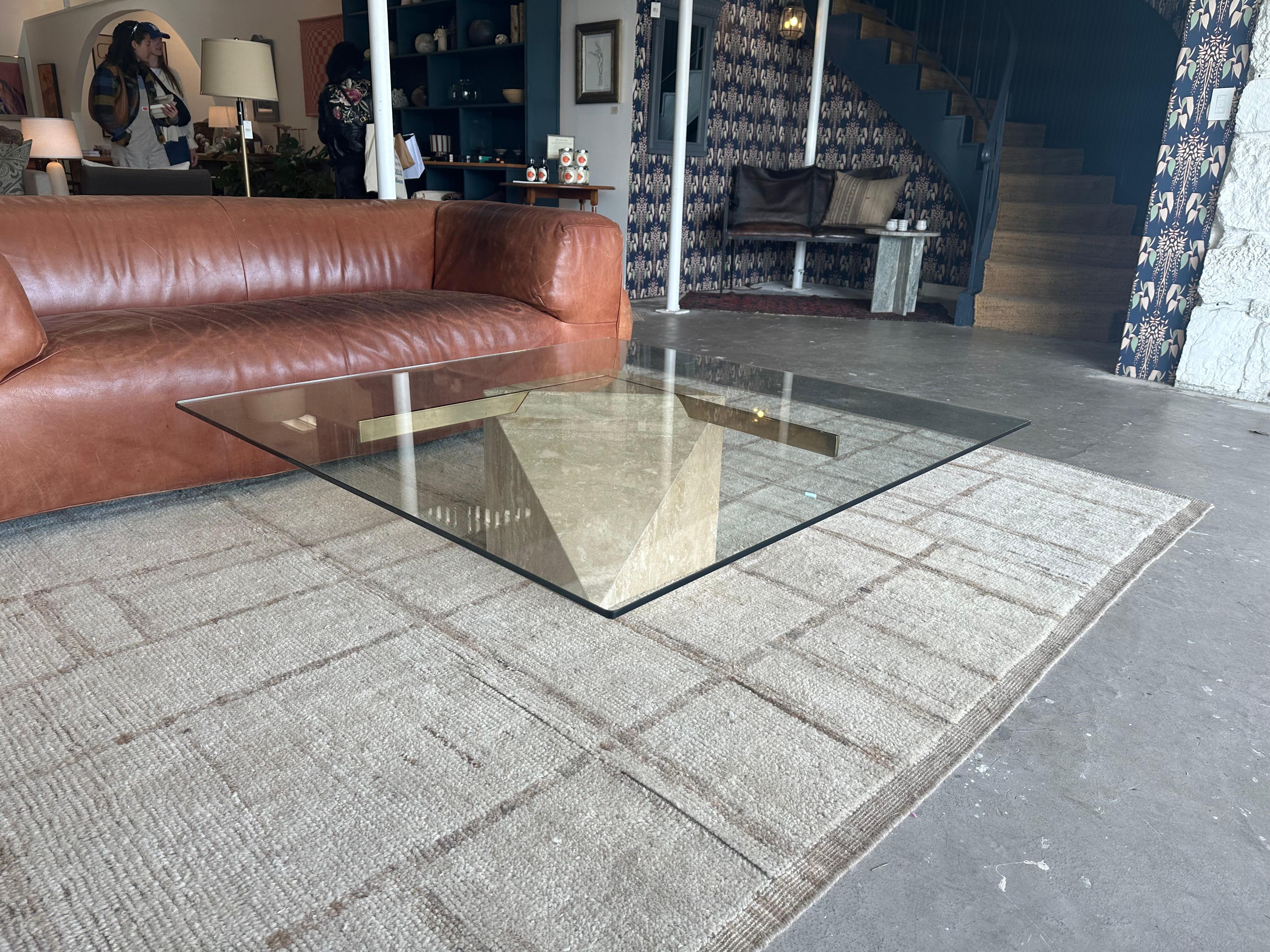 Vintage Postmodern Travertine and Glass Top Coffee Table with signature brass cross design.
Attributed to Artedi, Italy. 
Circa 1970s
