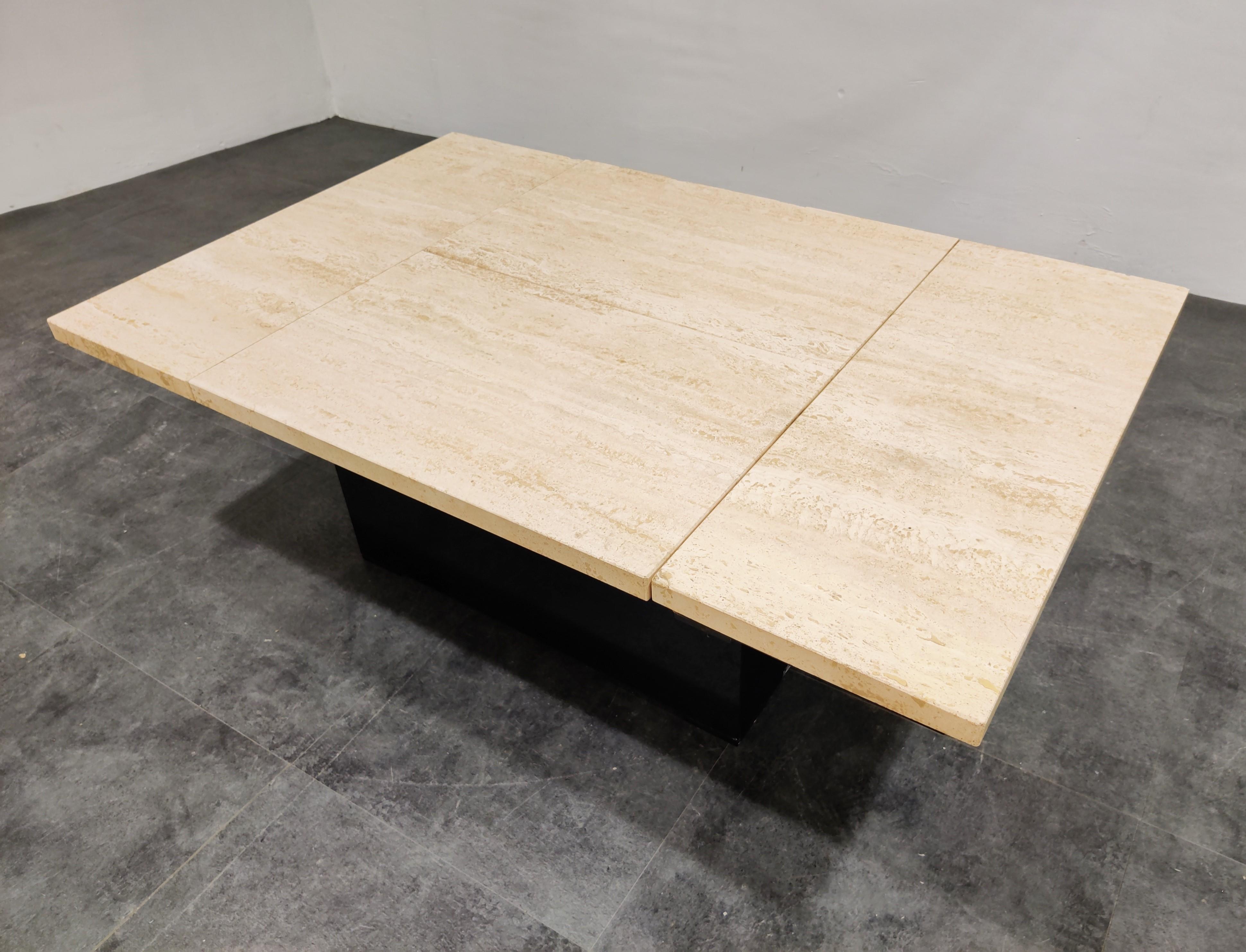 Vintage travertine hidden bar coffee table in the style of Willy Rizzo.

With the top closed it looks like a regular coffee table, but open it up and it reveals a mirrored storage space for glasses and bottles.

A great coffee table to add some