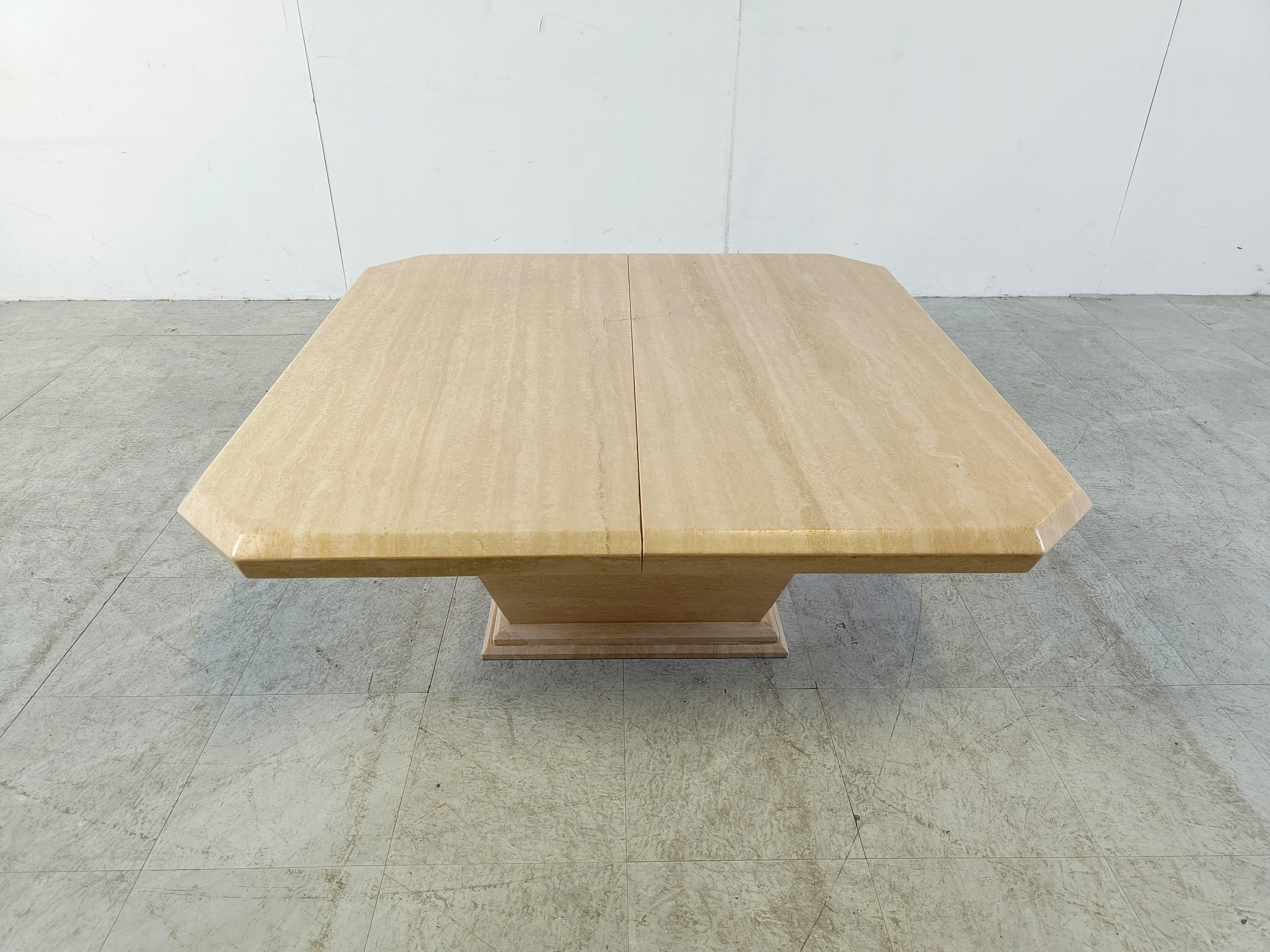 Vintage travertine hidden bar coffee table.

The two table tops slide open to reveal a storage space.

Elegant shaped base and top.

Beautiful natural colored travertine.

Good condition.

1970s - Italy

Dimensions:
Height: 45cm/17.71