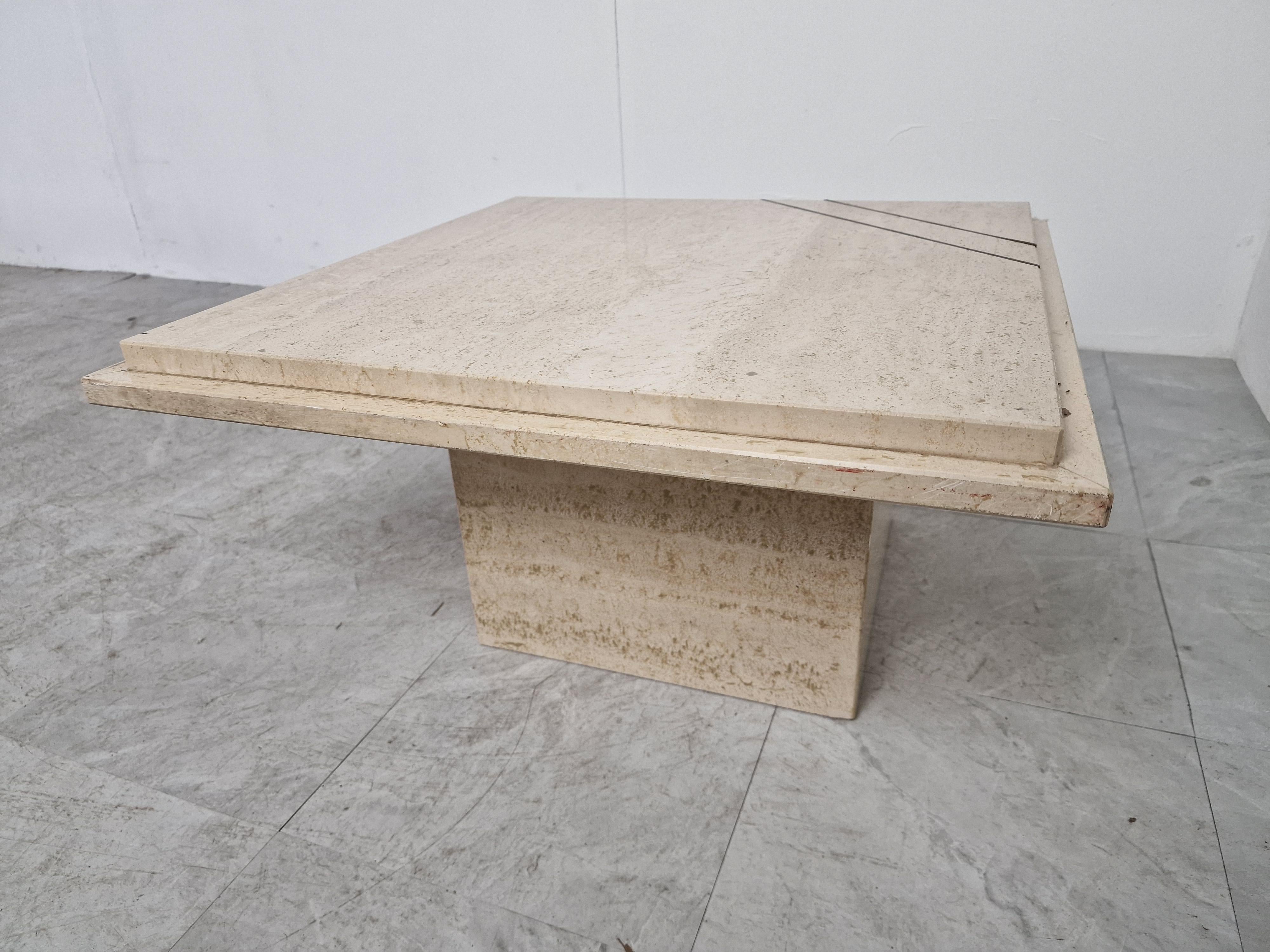 Vintage travertine coffee table or side table with brass inserts.

Beautiful timeless piece.

Small chip to one corner

1970s - Belgium

Dimensions
Height: 35cm/13.77