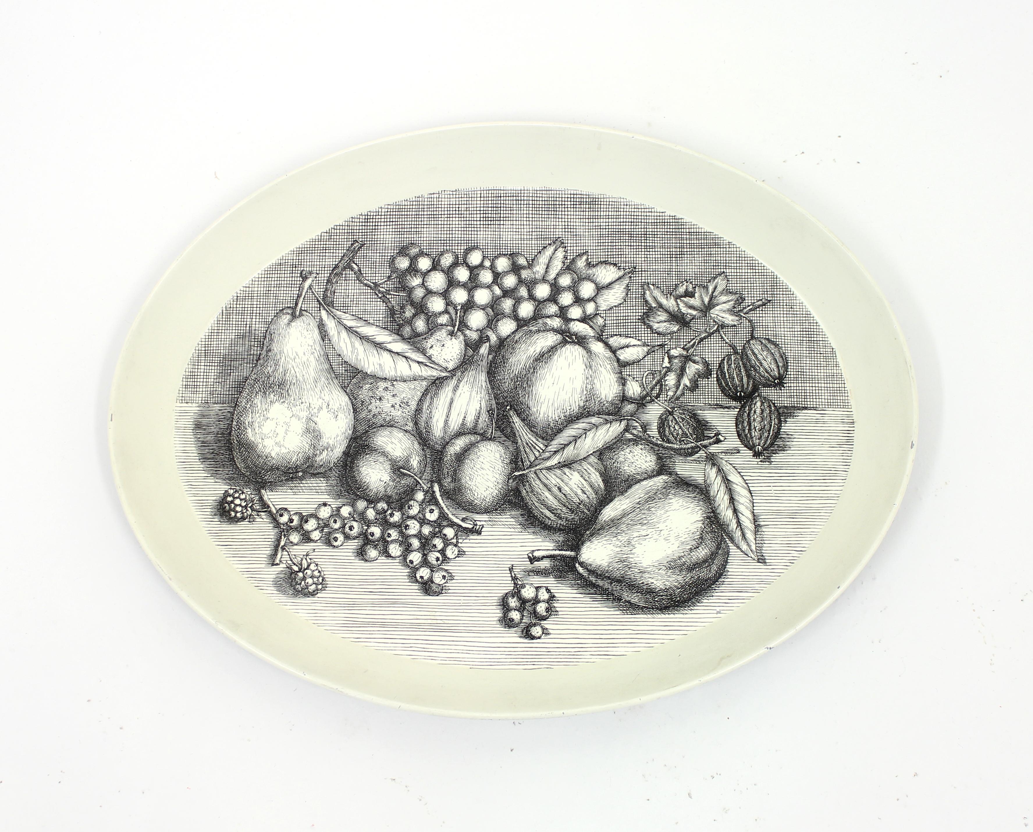 Fornasetti tray in black and white depicting fruits. Most likely made in the 1970s. Good vintage condition.