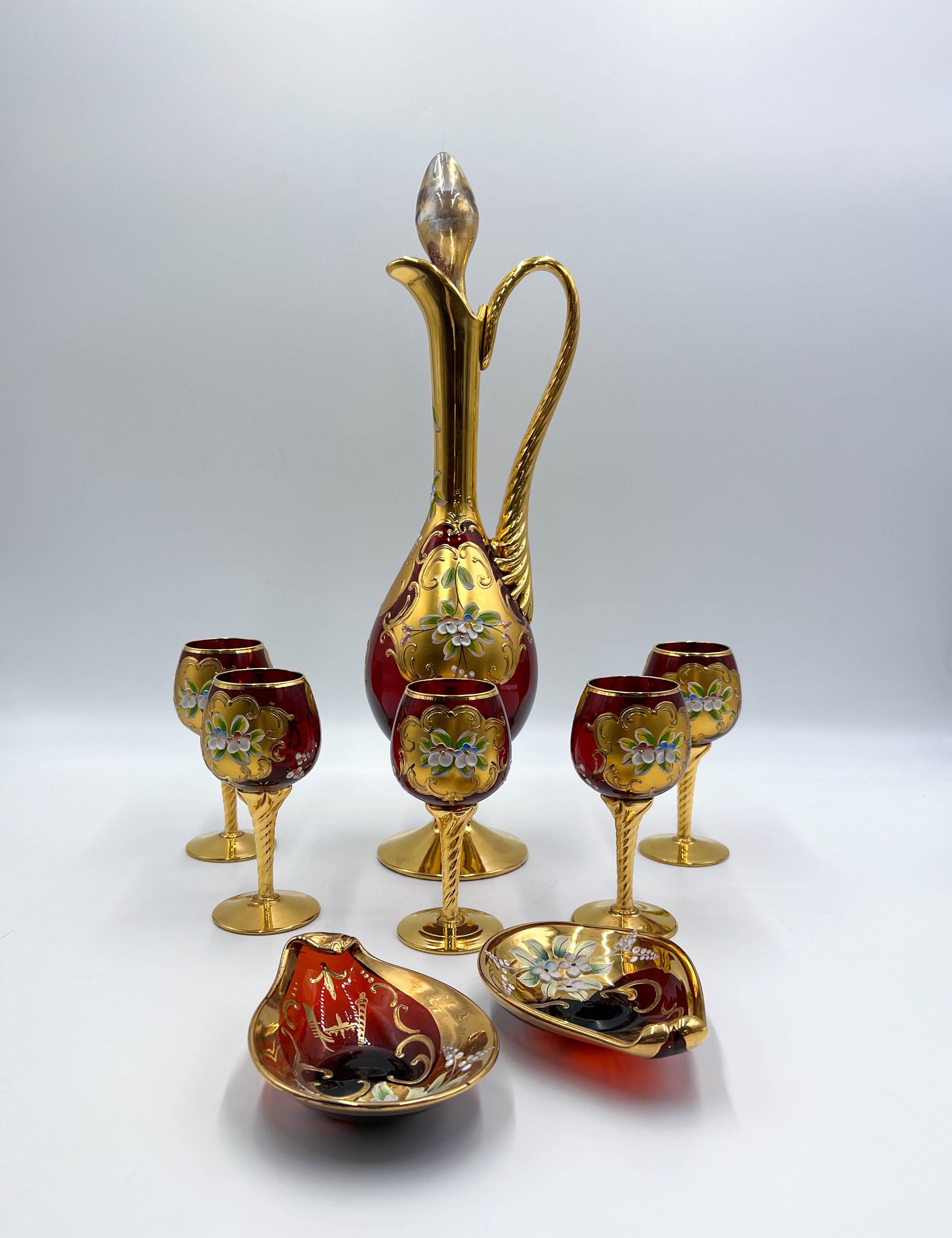 This Tre Fuochi Italian Venetian Murano hand-blown art glass set is a true testament to the artistry and craftsmanship of the ancient Venetian tradition. This exquisite set, crafted with meticulous attention to detail, showcases the splendor of