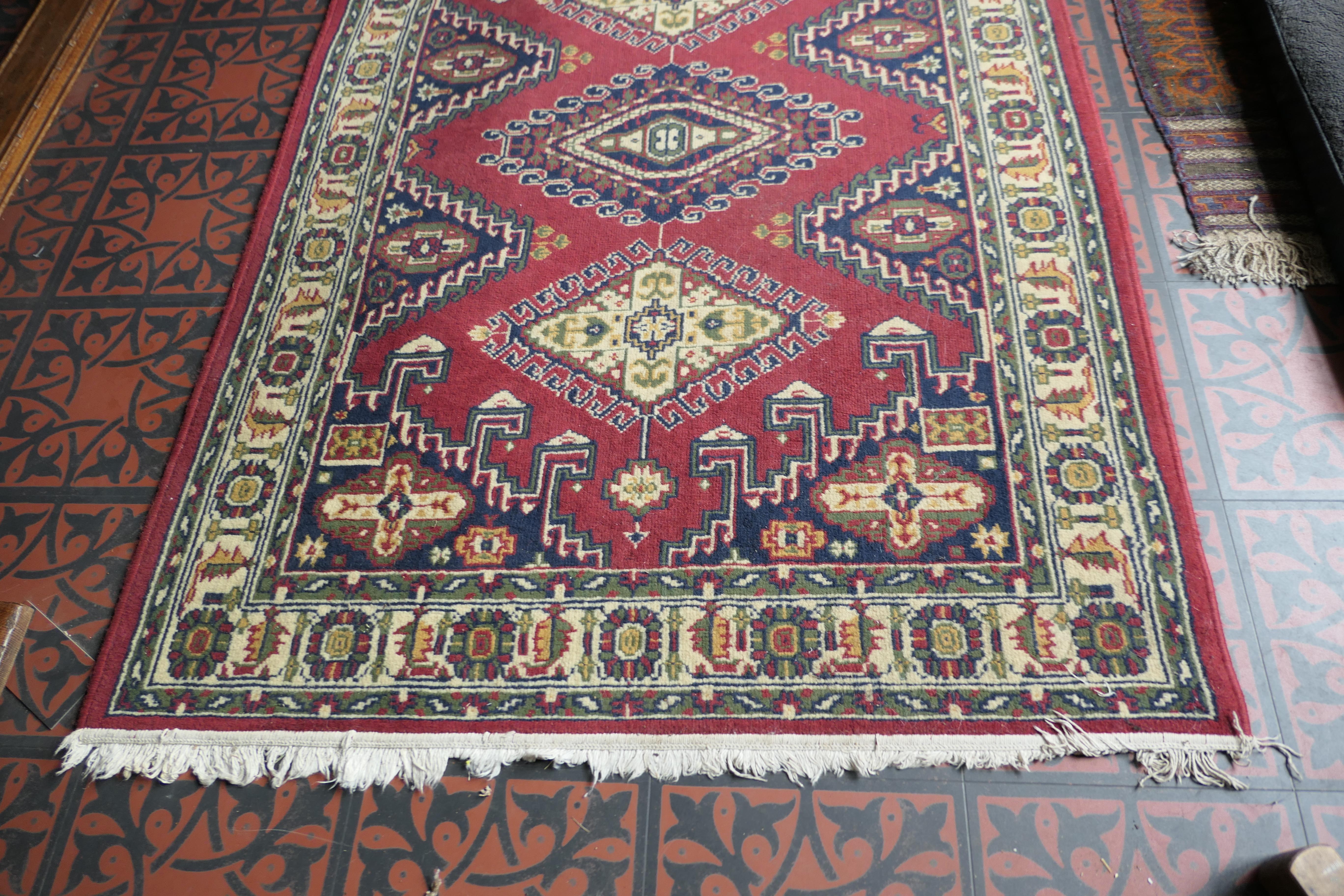 Vintage tree of life pattern wool carpet, rug
 
A superb looking piece dating from the early 20th century and has a lovely color palette with a red background and a border with green and cream 
The Wool Rug has a triple pattern along its length