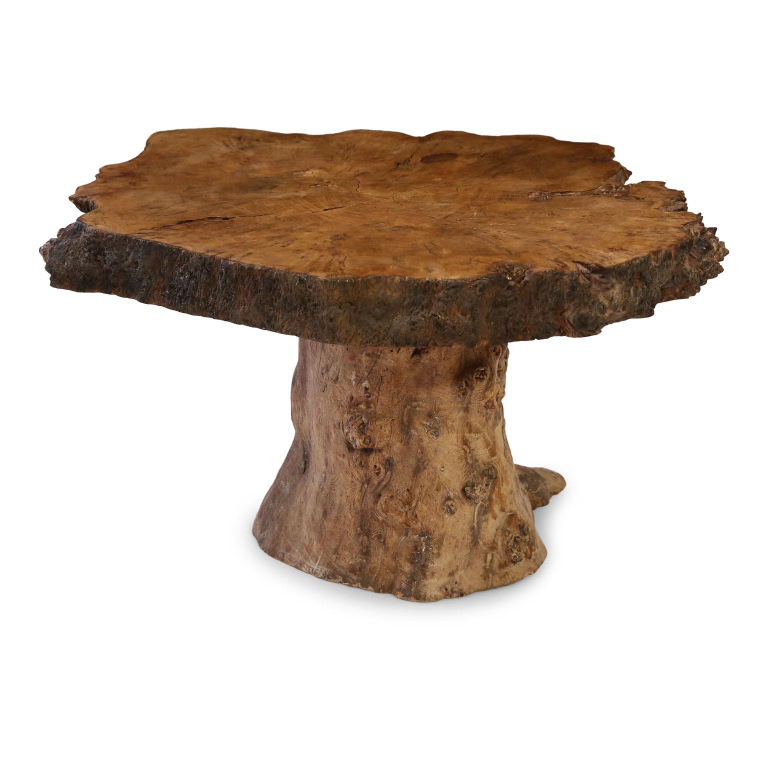 Vintage tree trunk coffee table from France. Trunk base supports larger tree trunk cross section top. Wonderful umber and brown colors.