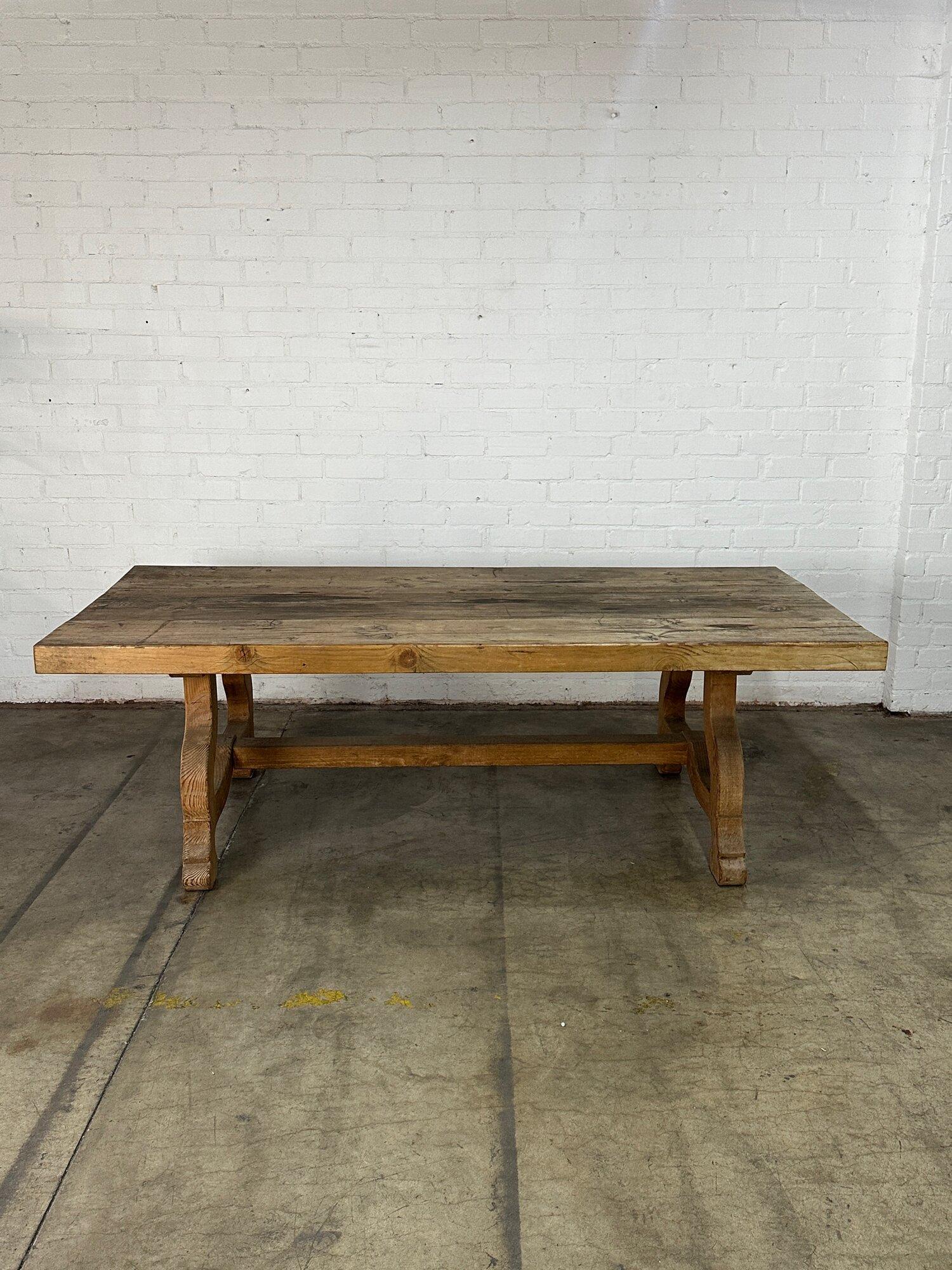 W96 D45 H31.5 Knee Clearance 27.5

VIntage aged and distressed trestle table in solid wooden construction. Table is very heavy and structurally sound and sturdy. Item is in as found aged condition with ample patina. Table will require a minimum of