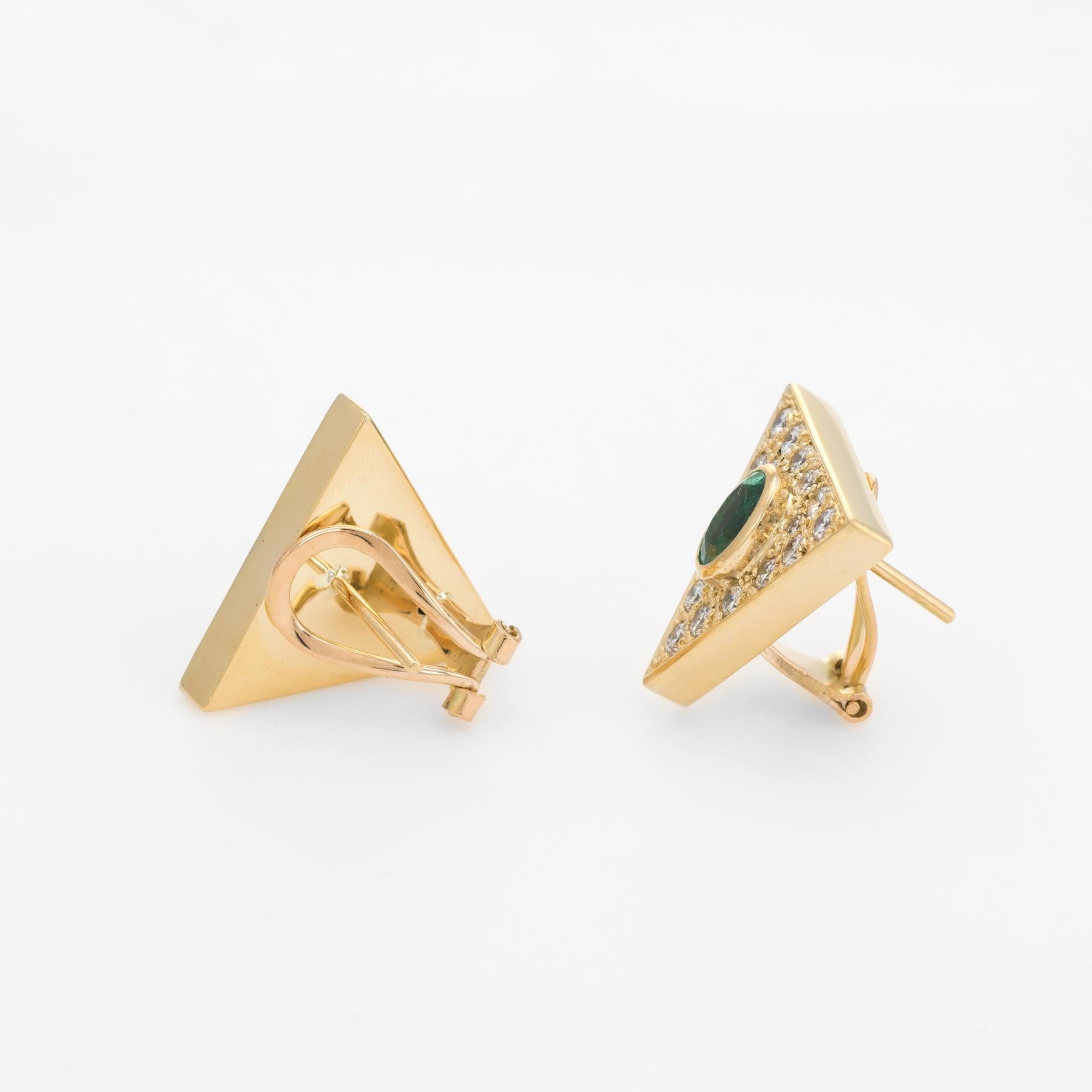 Stylish pair of vintage emerald & diamond earrings (circa 1970s to 1980s), crafted in 14k yellow gold. 

Two emeralds each measure 7mm x 5mm (estimated at 0.62 carats each - 1.25 carats total estimated weight), accented with 34 estimated 0.01 to