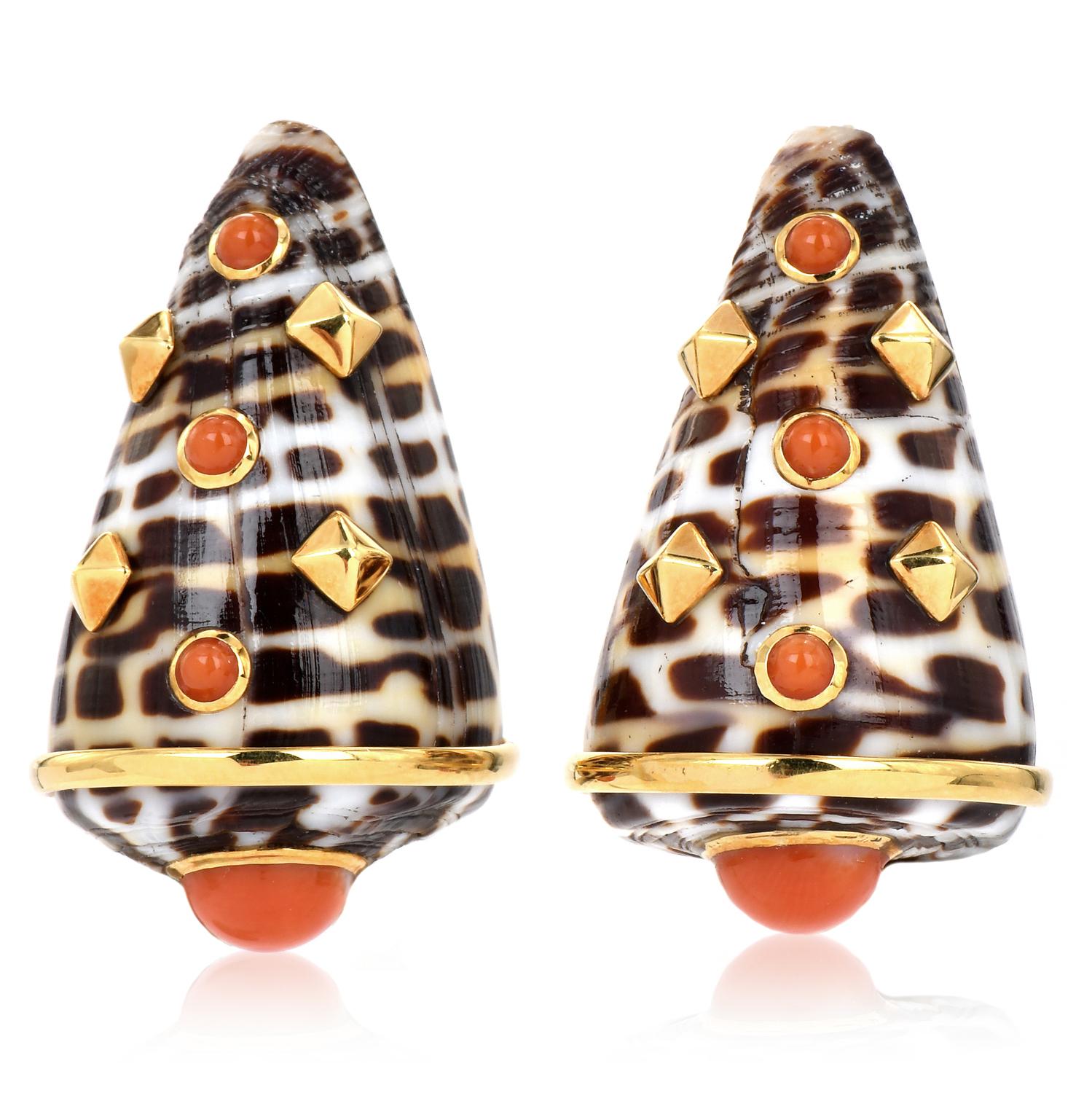 Celebrated this Pair of Exotic Shells mounted in 18kt Yellow Gold & Bezel set with a round Coral Bead and Primed shape gold. These Clip On Vintage earrings are in excellent condition,

Signed Trianon Parent Company of Seaman Schepp.
Weight: 20.6