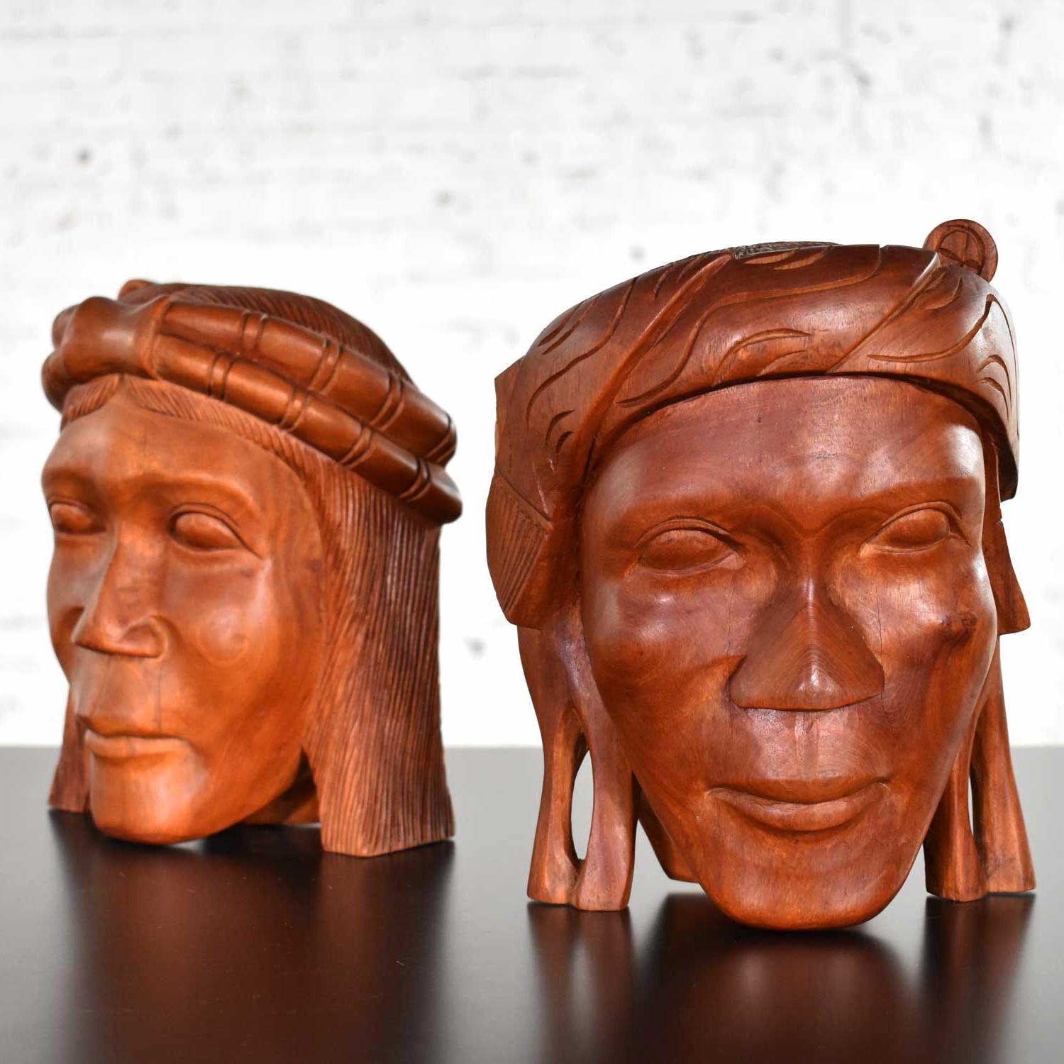 Handsome pair of tribal figural carved wood head bookends. They are in awesome vintage condition. Please see photos, circa mid-20th century.

If you are looking for unique bookends to hold your favorite book collection…look no further. This