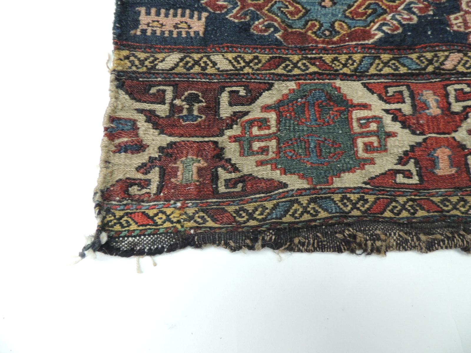 Vintage tribal design Kilim rug - Grain Sack fragment
Vintage Shahsavan fragment of a Kilim rug in the front, and traditional Anatolian kilims all around. This piece is a Soumak which is a term used for weft wrapping weaving technique and it is