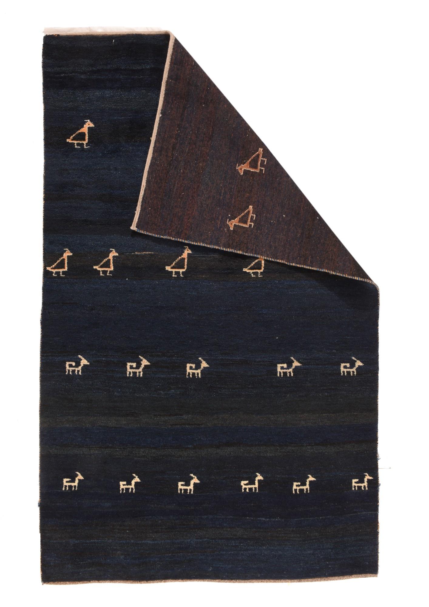 Persian Tribal Gabbeh 4'11'' x 8'1''. From the esteemed Qashghai tribal weavers of Fars province in SW Persia, this rustic scatter shows two rows each of small, ecru dogs facing right and two rows of plump birds in the same configuration. Probably