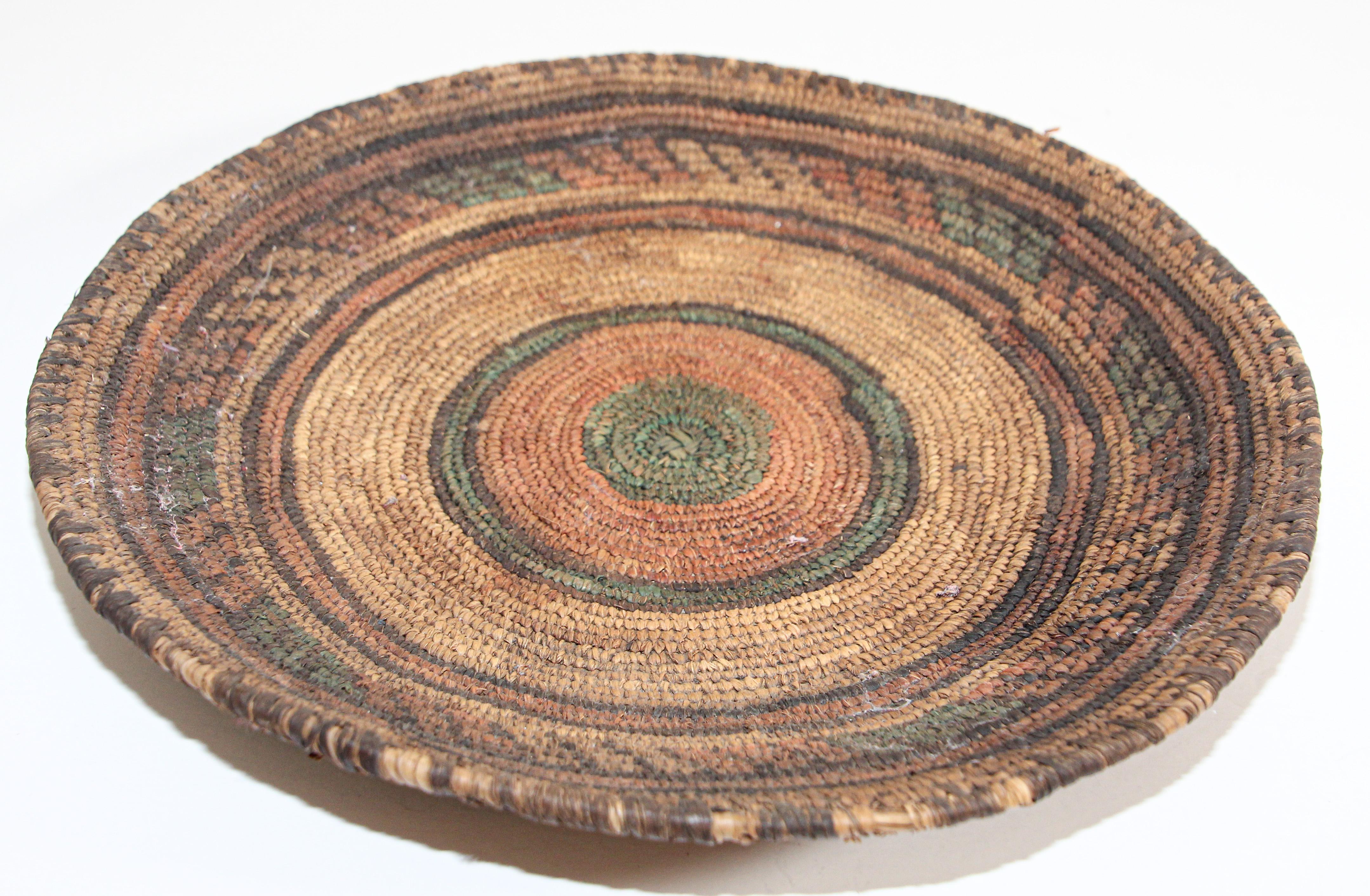 Vintage Tribal handwoven seagrass ethnic round South African basket.
Beautiful old artisanal handwoven basket with tribal designs and patterns all around.
Handwoven by women in Zambia.
Great patina from years of daily use to make each basket one