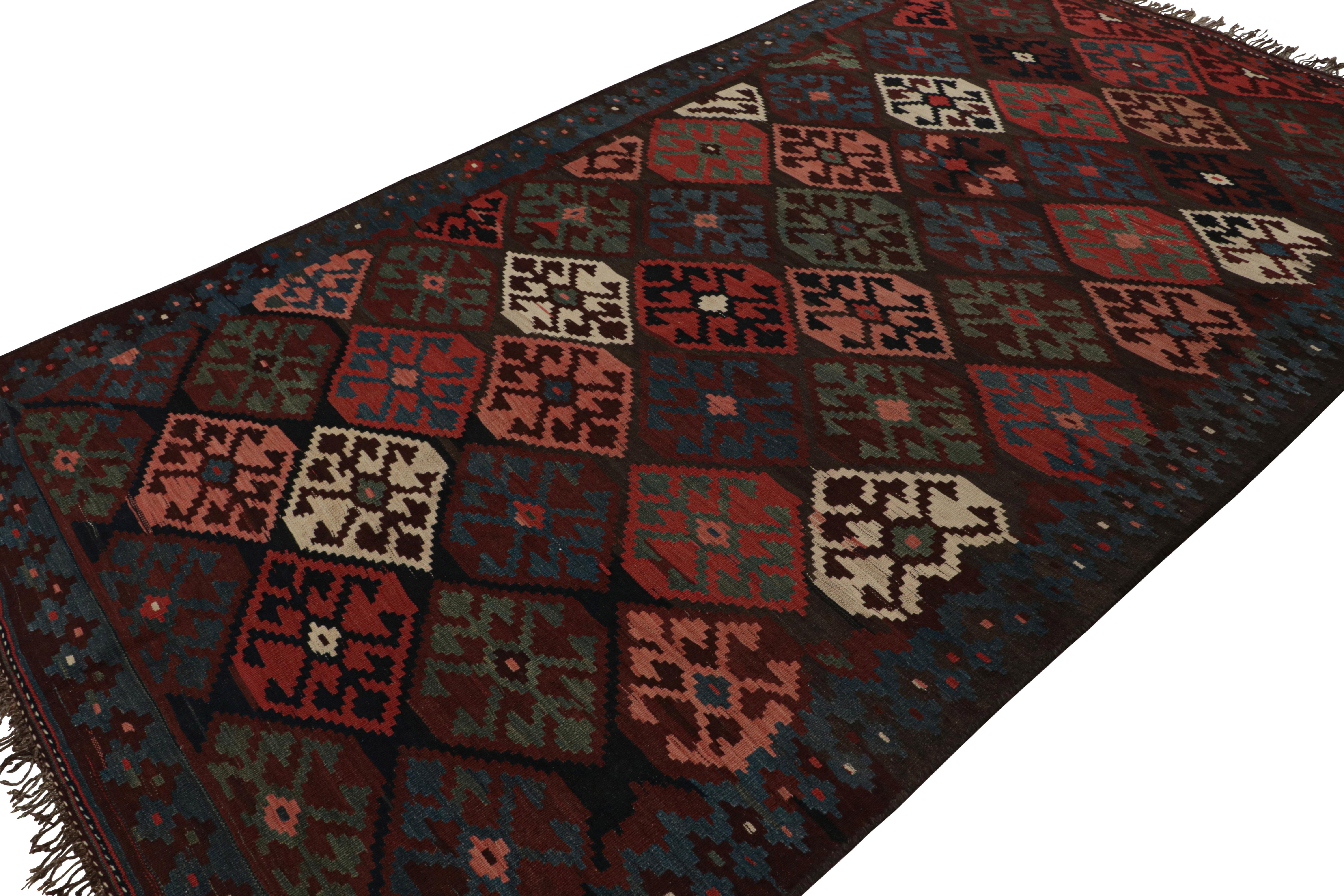 This vintage 7x11 Persian Kilim is the latest to join Rug & Kilim’s selection of vintage flatweaves. 

On the Design:

Handwoven in wool circa 1950-1960, the colorful piece is full of intricate, playful details. The play of red, blue-brown tones