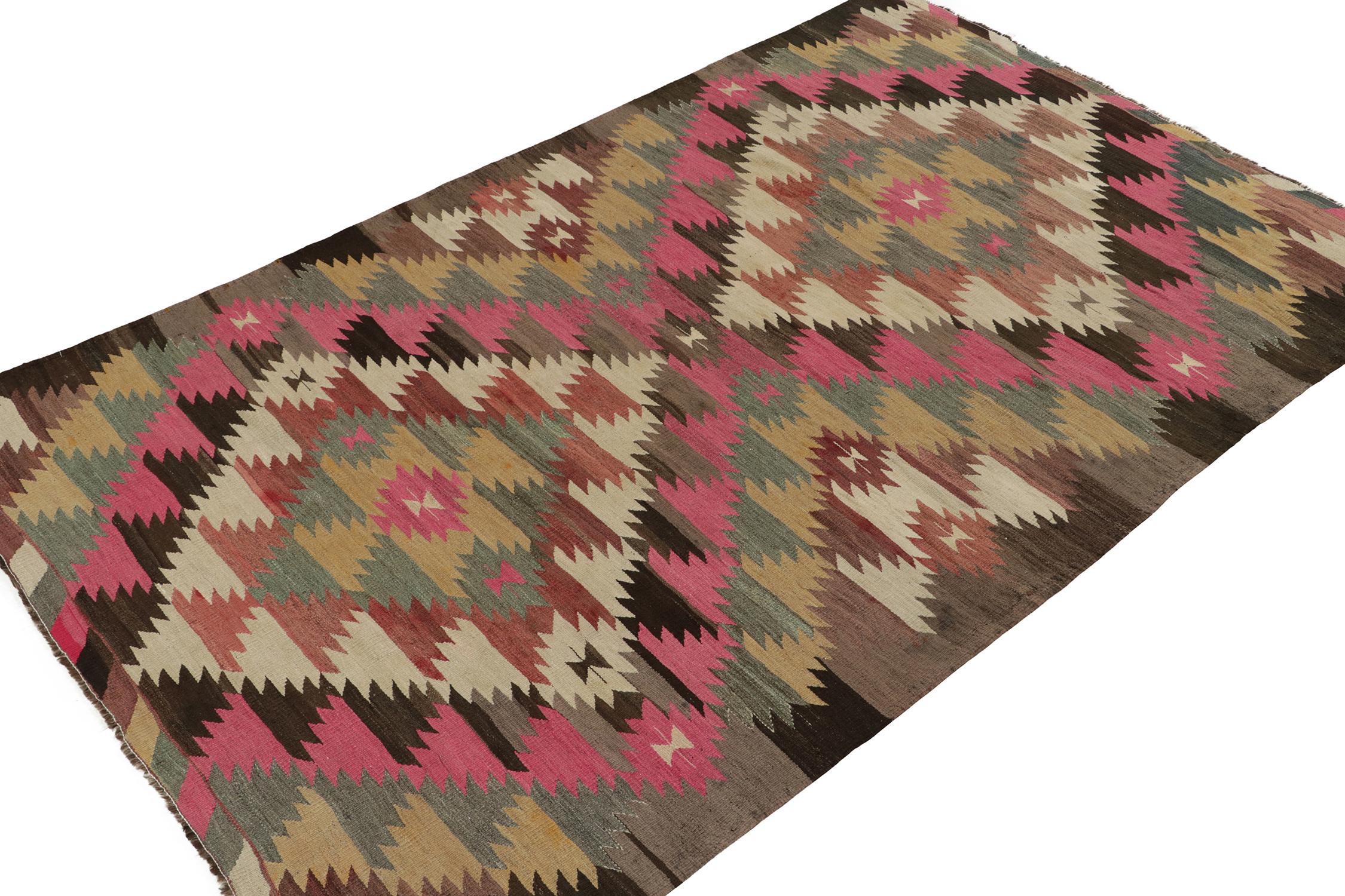 This vintage 7x10 tribal Kilim is a new addition to Rug & Kilim’s mid-century curations. Handwoven in wool, it originates from Turkey circa 1950-1960.

Further On the Design: 

This flat weave hosts an elaborate diamond-shaped pattern that