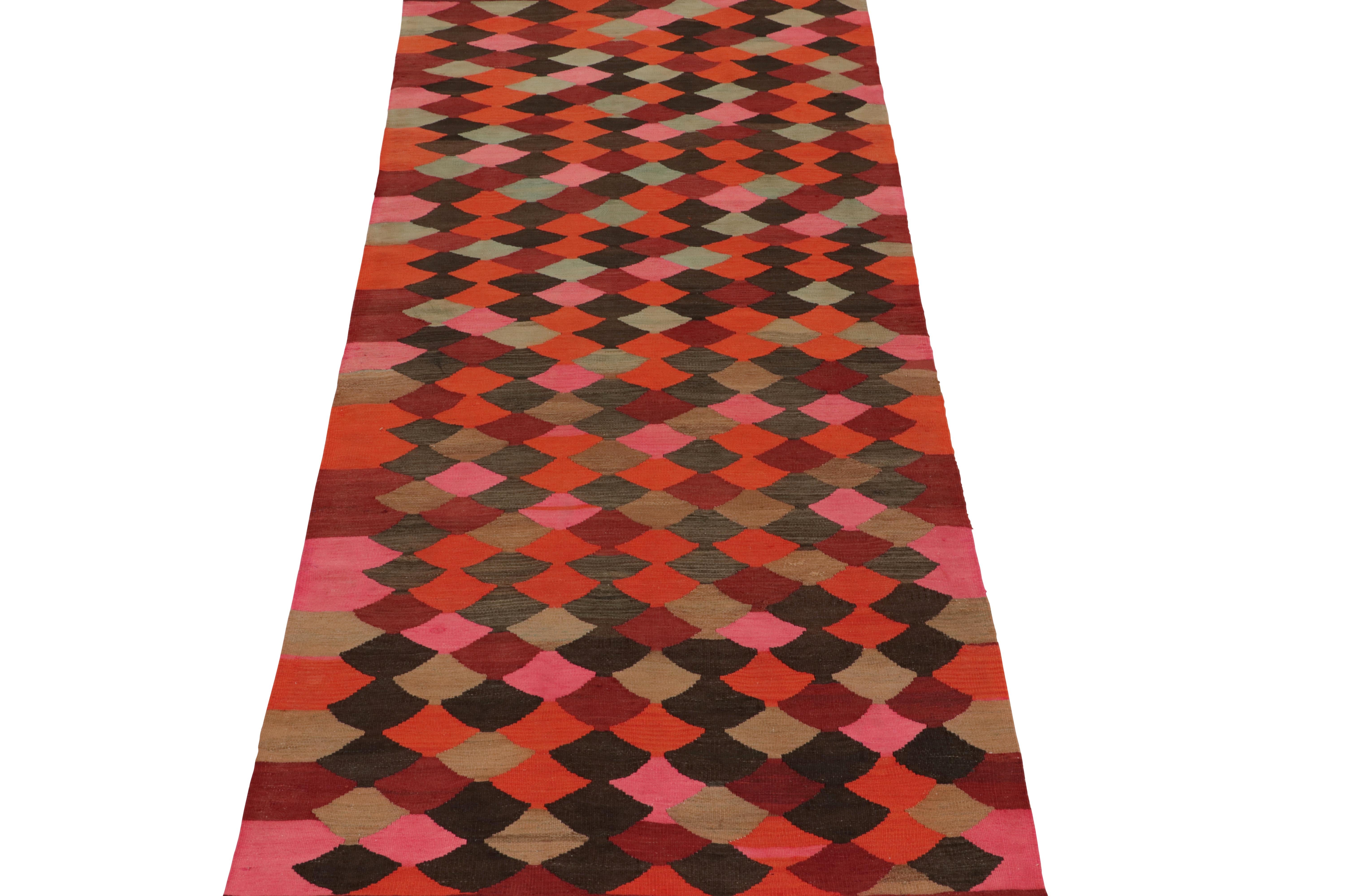 This vintage 4x9 Persian Kilim hails from the mountainous Karadagh regions of Iran, and enjoys a vibrant polychromatic design. Handwoven in wool, it originates circa 1950-1960.

Further On the Design: 

This runner enjoys an all over geometric