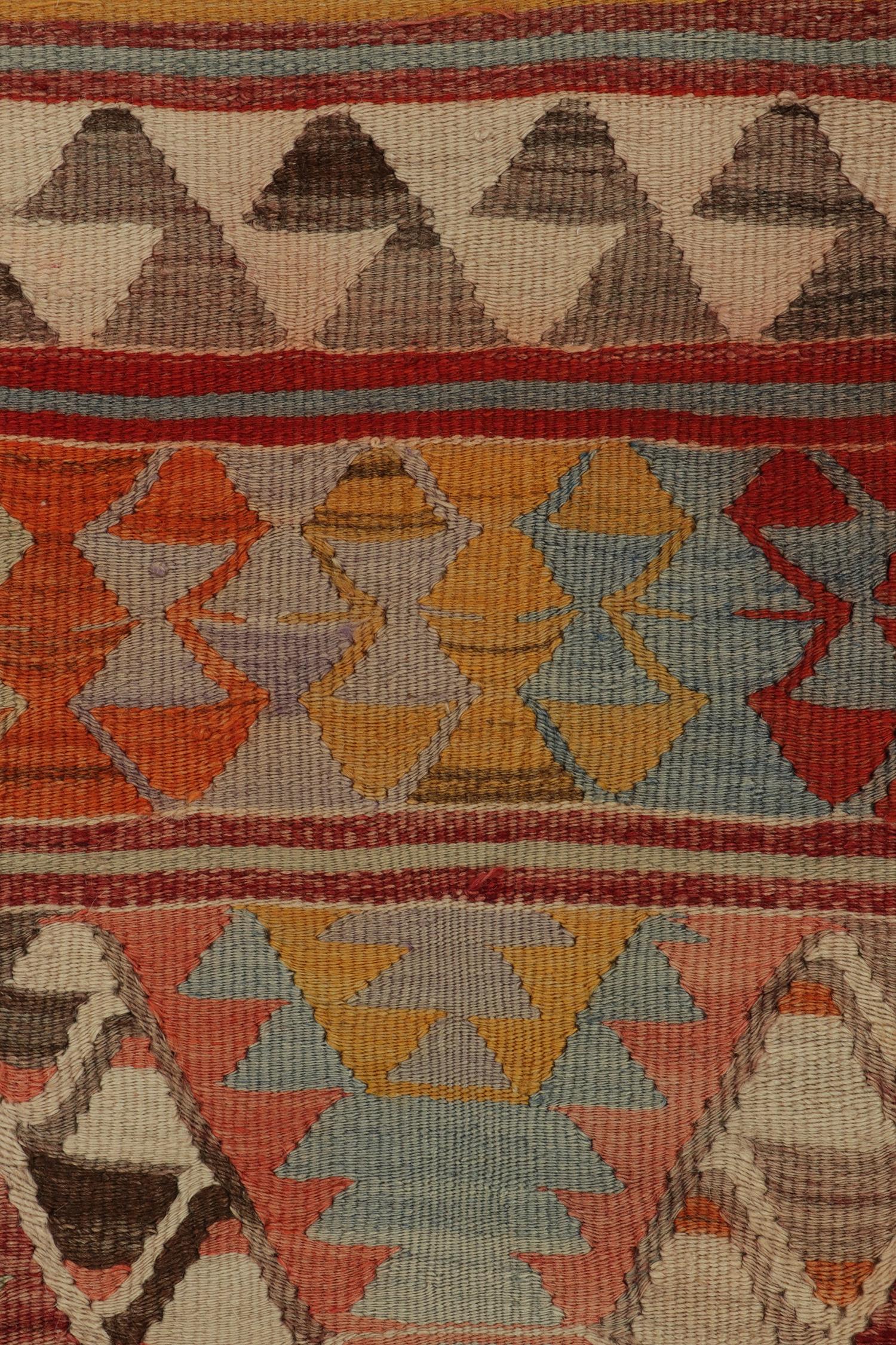 Mid-20th Century Vintage Tribal kilim rug in Polychromatic Geometric Pattern by Rug & Kilim For Sale