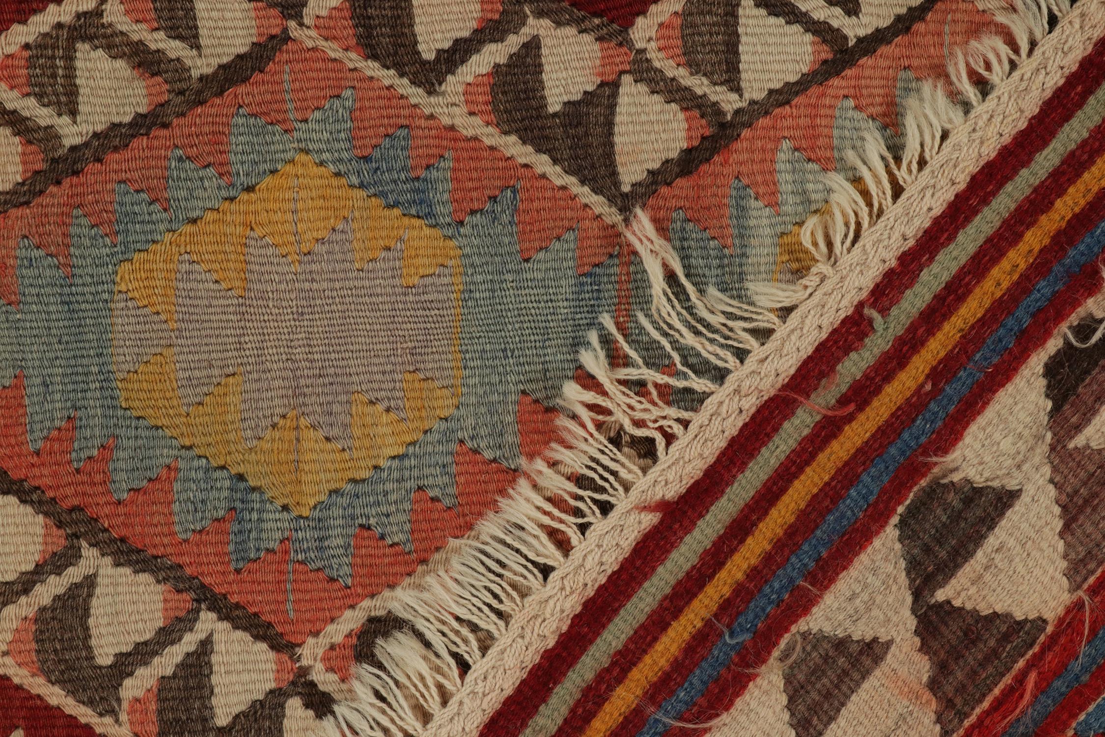 Wool Vintage Tribal kilim rug in Polychromatic Geometric Pattern by Rug & Kilim For Sale