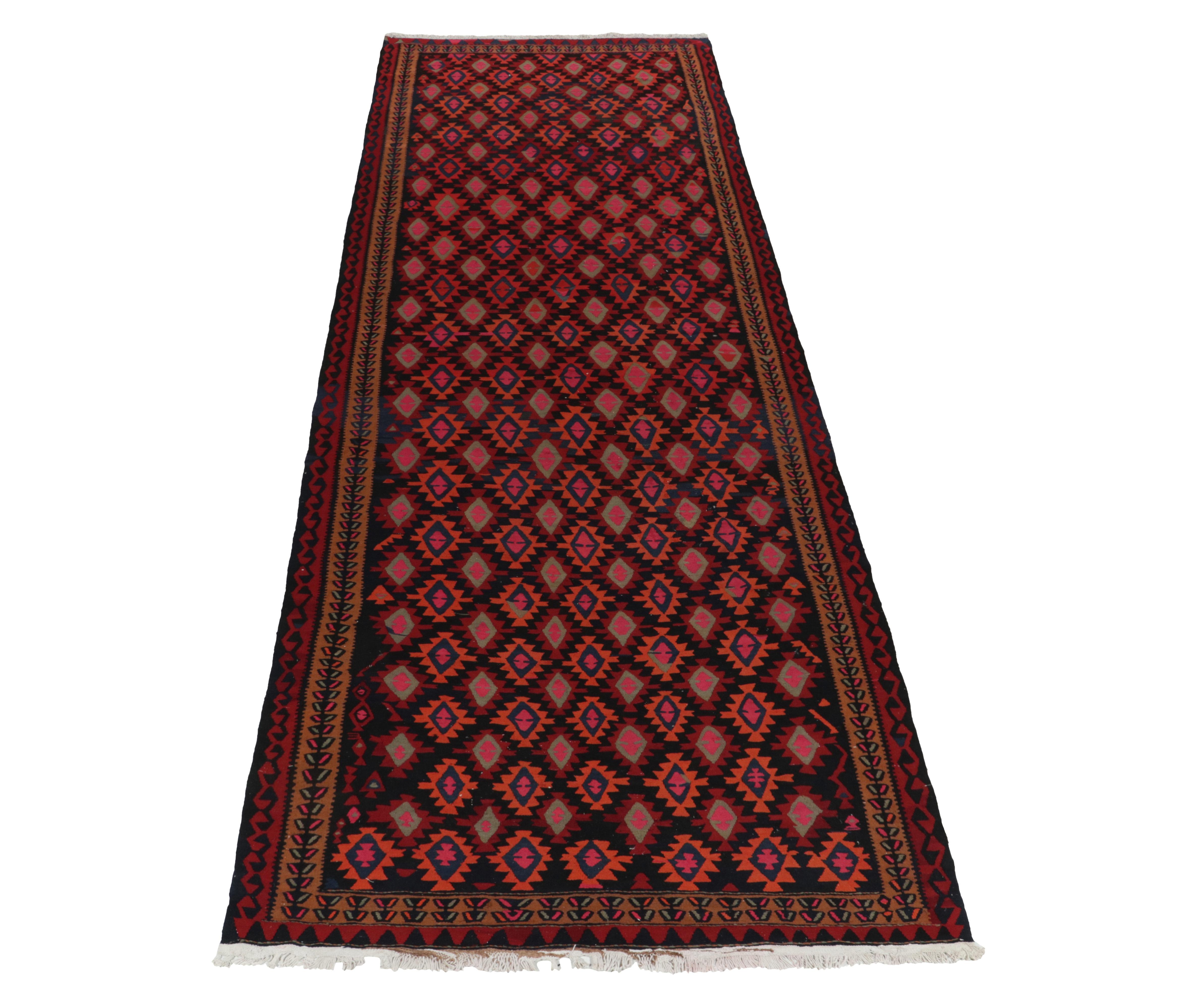 Handwoven in fine wool, a 6x16 vintage kilim rug originating from Turkey circa 1950-1960, now joining our coveted flatweave curations. 

The unique carpet casts a lasting impression with tribal patterns enjoying rich red and black with unusual