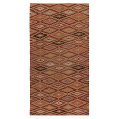 Tapis Kilim tribal vintage à motifs géométriques rouges, oranges et bleus